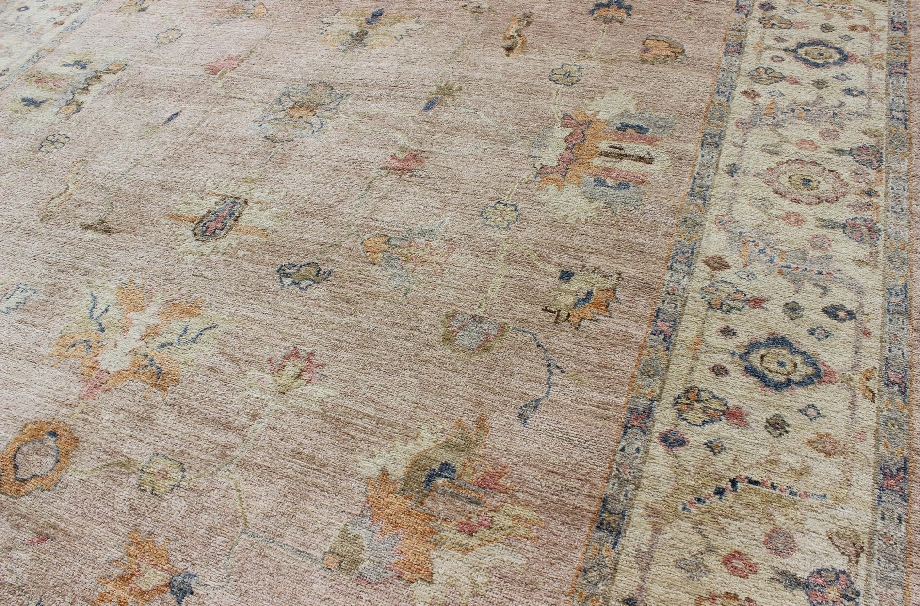 Keivan Woven Arts Angora Turkish Oushak Rug in Dusty Pink and Ivory. Keivan Woven Arts / rug AN-134565, country of origin / type: Turkey / Angora Oushak.
Measures: 10'3 x 13'9 
From our Angora collection, this piece is made with a combination of