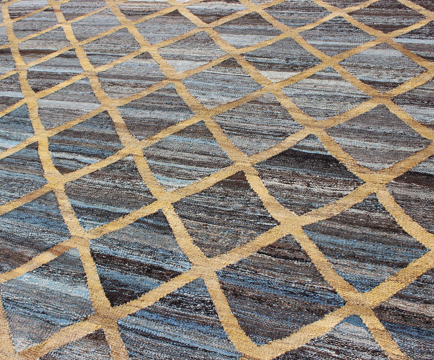 Keivan Woven Arts Flat-Weave Kilim in Diamond Gold Design With Blue and Charcoal. Keivan Woven Arts/ rug AFG-13486, country of origin / type: Afghanistan / Kilim
Measures: 6'4 x 8'10 
This colored piece features a design that evokes an easy vibe,