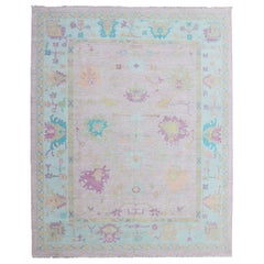 Tappeto Keivan Woven Arts in lana moderna Oushak con bordo rosa e blu ghiaccio  9'5 x 12'1
