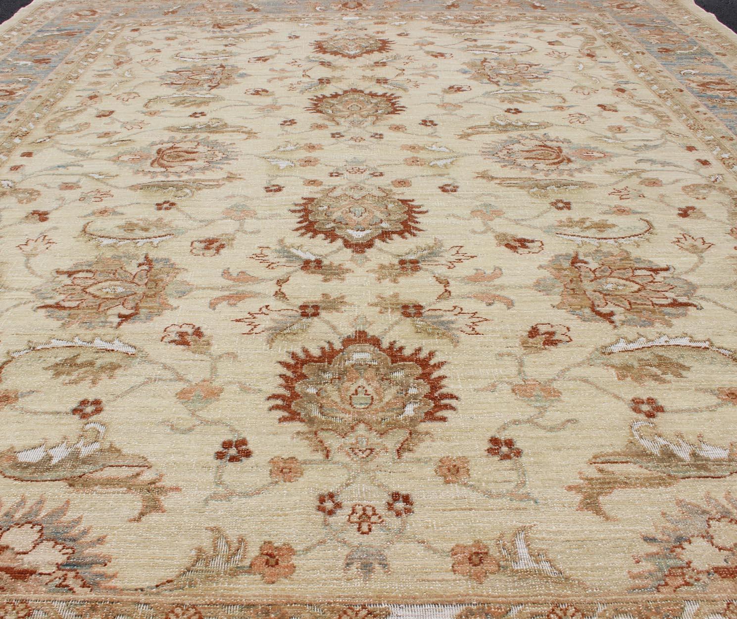 Pakistani Keivan Woven Arts Vintage Cream Sultanabad Rug With Pops of Blue and Red For Sale