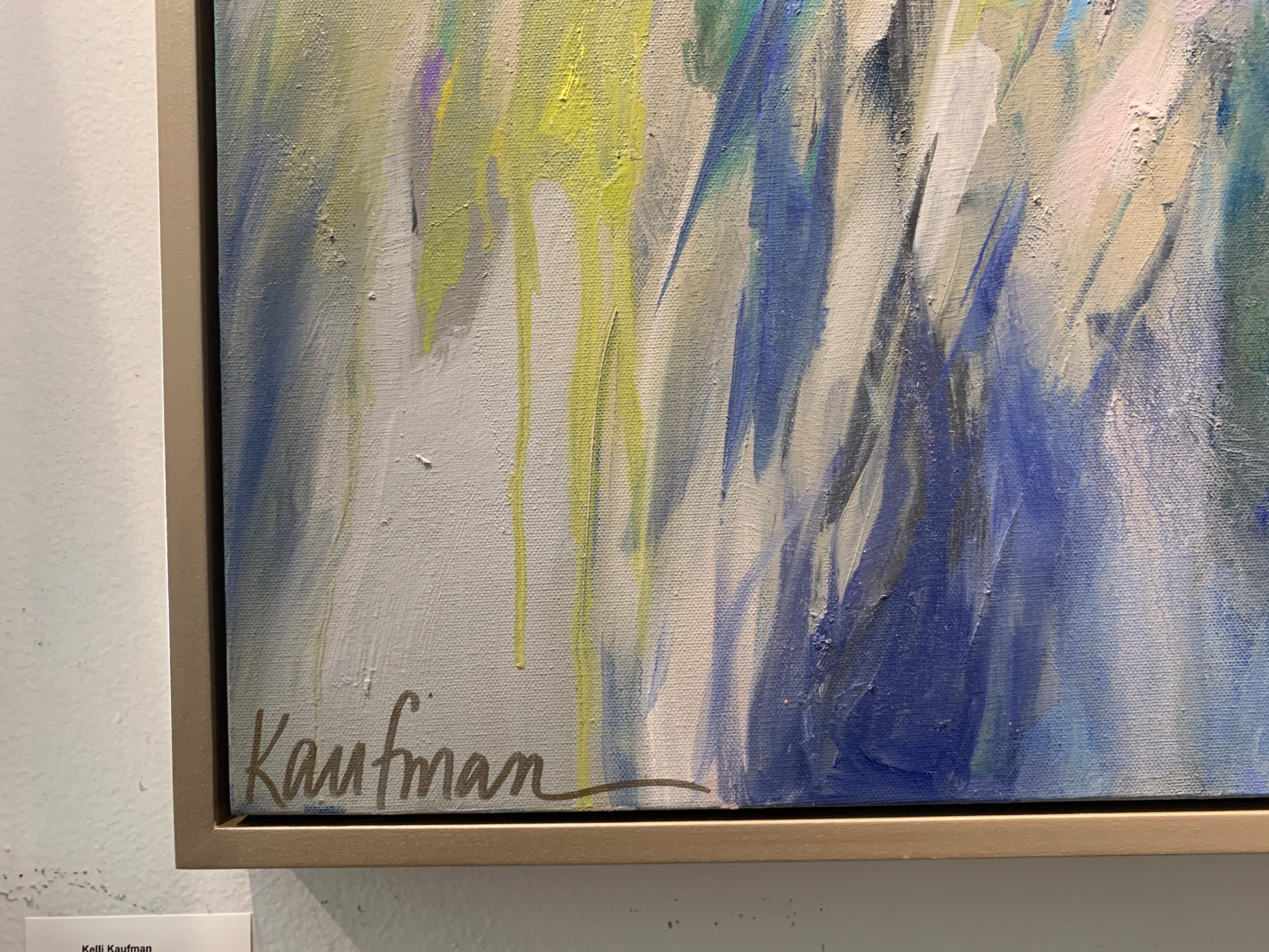 'Marsh Awakening' is a large framed oil and wax on canvas abstracted landscape created by American artist Kelli Kaufman in 2021. Featuring a palette mostly made of warm tonalities, this square format piece depicts a marsh on the Gulf Coast. The