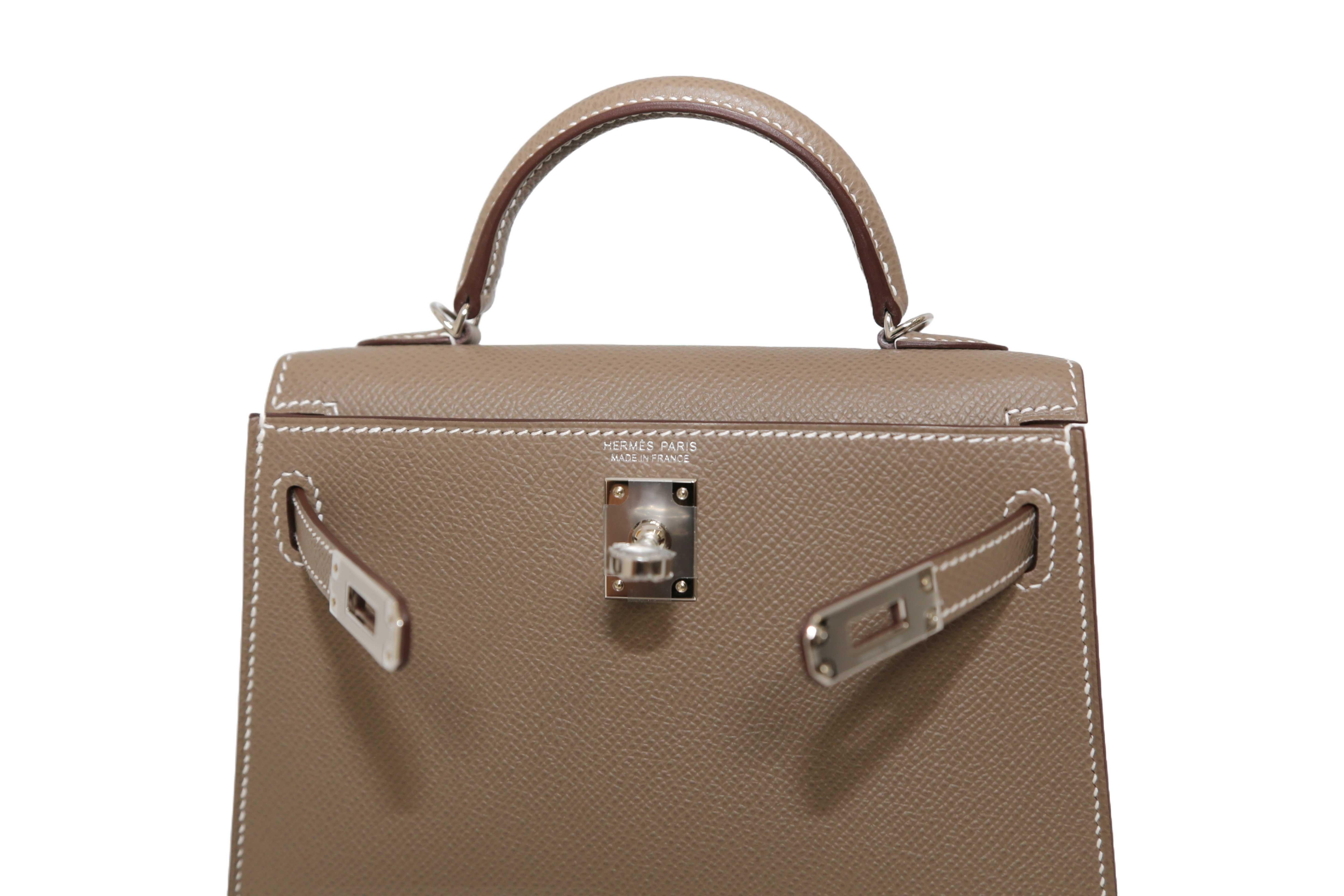 This Kelly, in the Sellier style, is in one of the most popular colours Hermes sells, Etoupe, a perfect neutral, in Epsom leather with gold hardware and has contrast stitching making it a standout, two straps with front toggle closure, single rolled