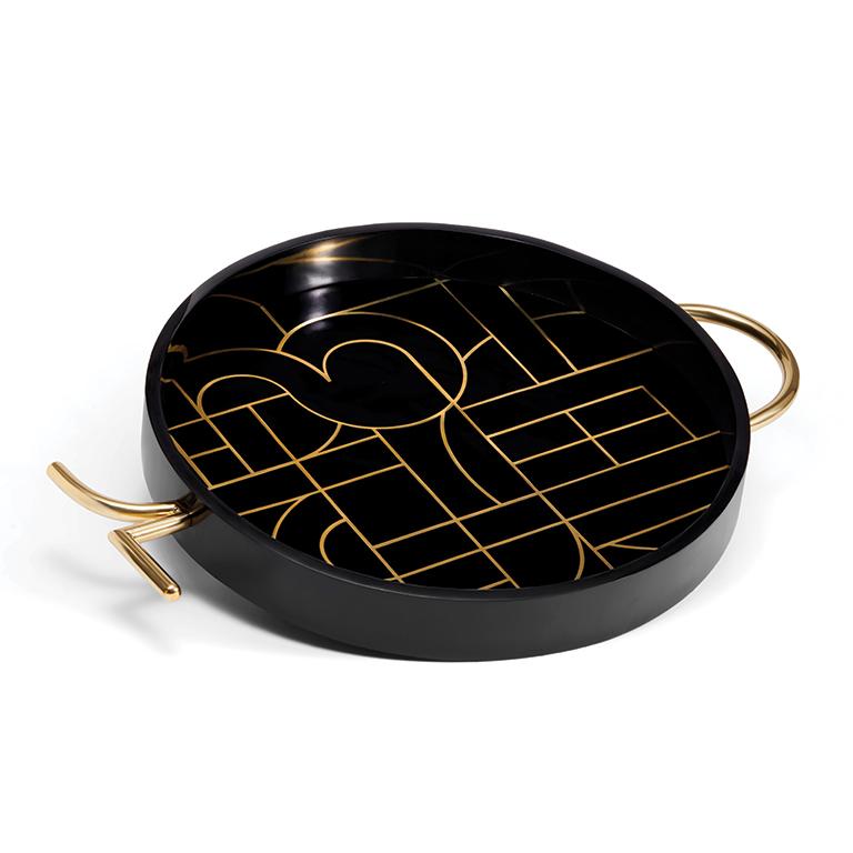 Designed with brilliant rule-breaking designer Kelly Behun, a surreal decorative tray that offers an elevated, whimsical experience. Beautifully crafted from black resin inlaid with a maze of brass.

DETAILS
16 D x 2 H in (41 D x 5 H cm)
Presented