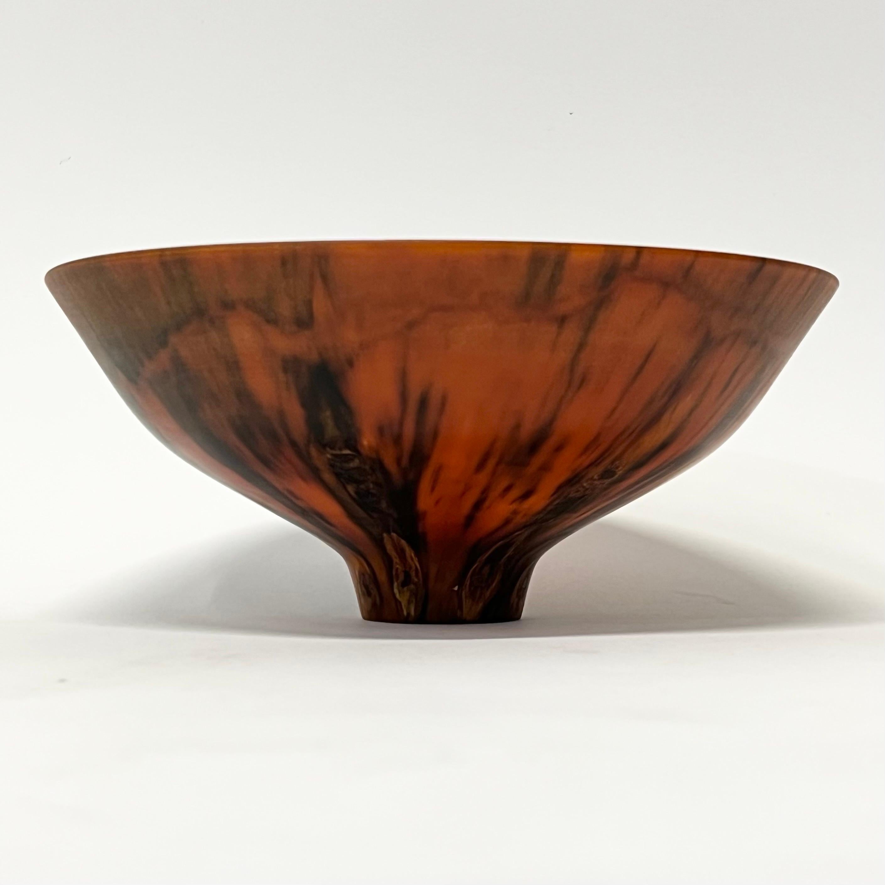 Stunning translucent Norfolk Pine modern bowl by multi-award winning wood lathe artist, Kelly Dunn. Dunn lives on the north end of the Big Island of Hawaii. He has created bowls, hollow vessels, and art forms full time for art galleries and private