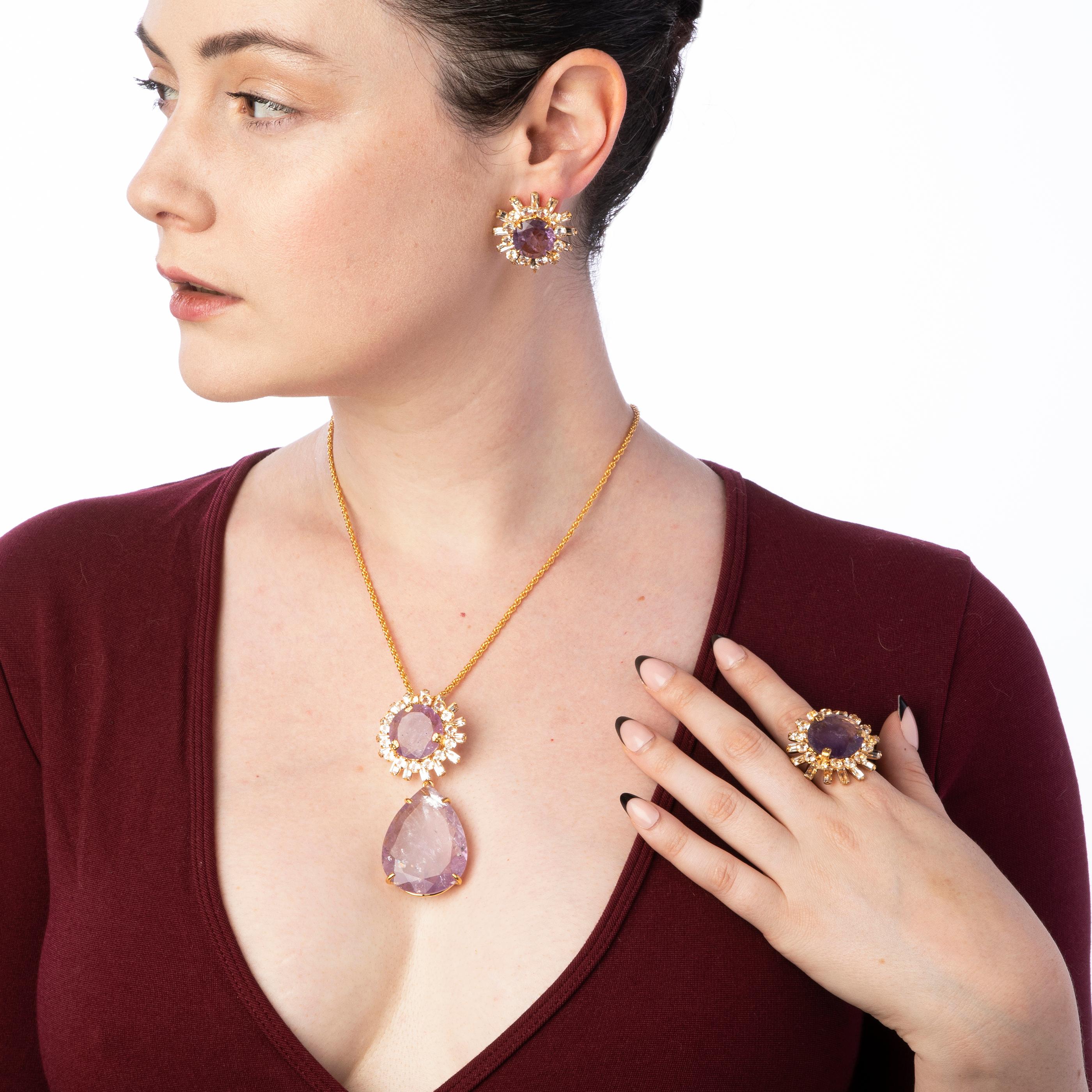 The Kelly Pendant, fashioned from semi-precious stones, boasts a distinct vintage design.

SKU: PND-BG-3
Stones: Amethyst & Clear Quartz
Material: 14K Gold Plated
Dimensions: 2 3/4' x 1 1/4'
*The chain is sold separately in another listing. This