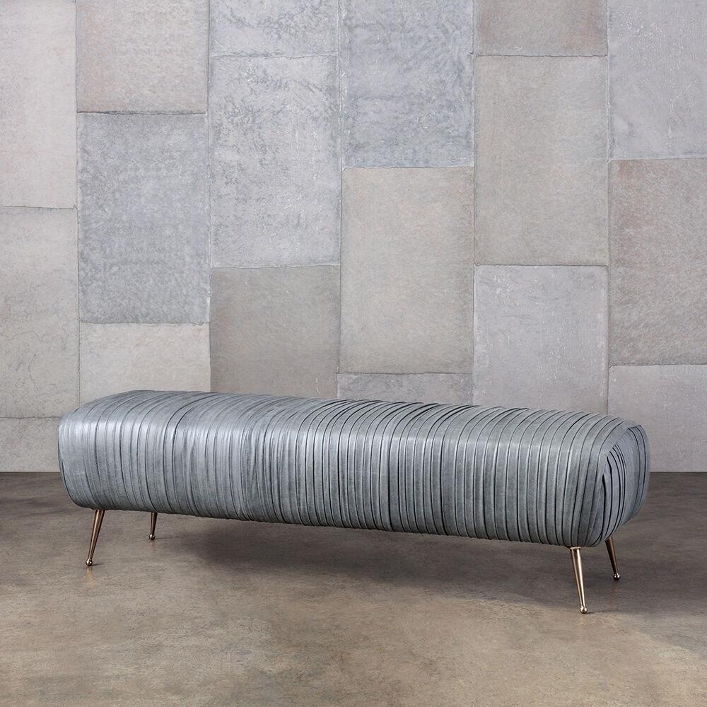 The delicate lines of the Souffle bench are created by a signature ruched leather detail. Full-finish, vegetable-dyed lambskin is hand-stitched on to the frame. His exquisitely detailed and luxurious bench sits on tapered legs of solid cast bronze.