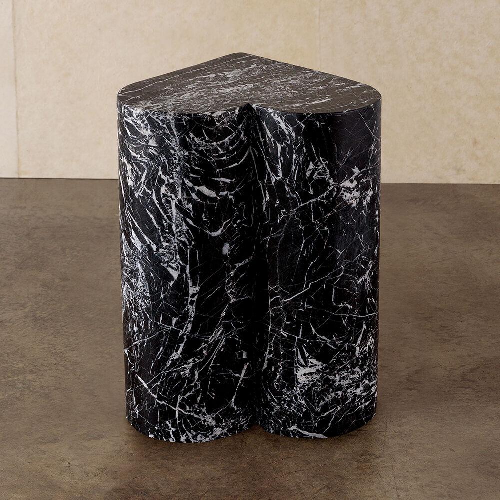 The amorata stool highlights the beauty of natural stone in an iconic and sculptural form. This stool or side table features solid, hand-carved stone in either a nero marquina or white marble.