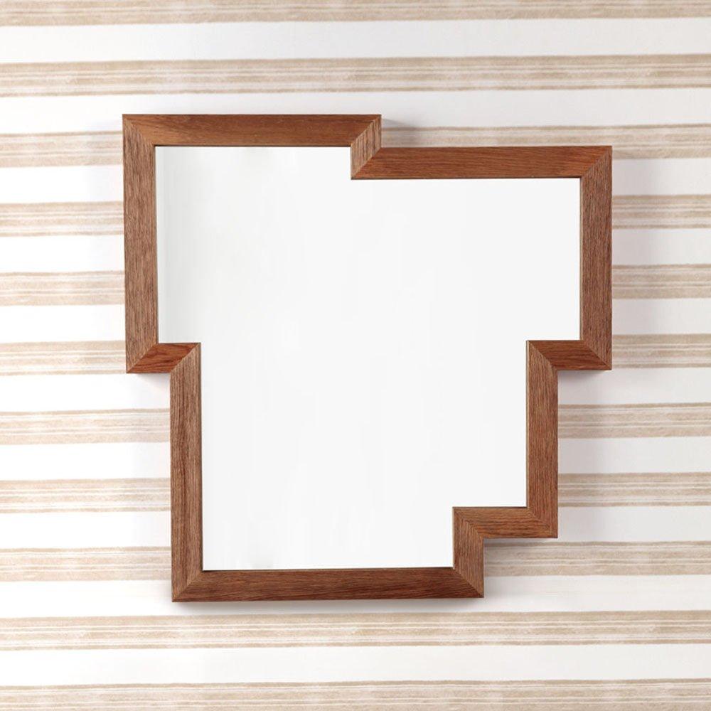 With a nod to Cubism the Chardon mirror features a graphic, asymmetrical shape, framed in deeply wire brushed and mitered solid oak. Available in our standard ebonized and natural wood finishes this mirror comes with a pair of inset cleats offering