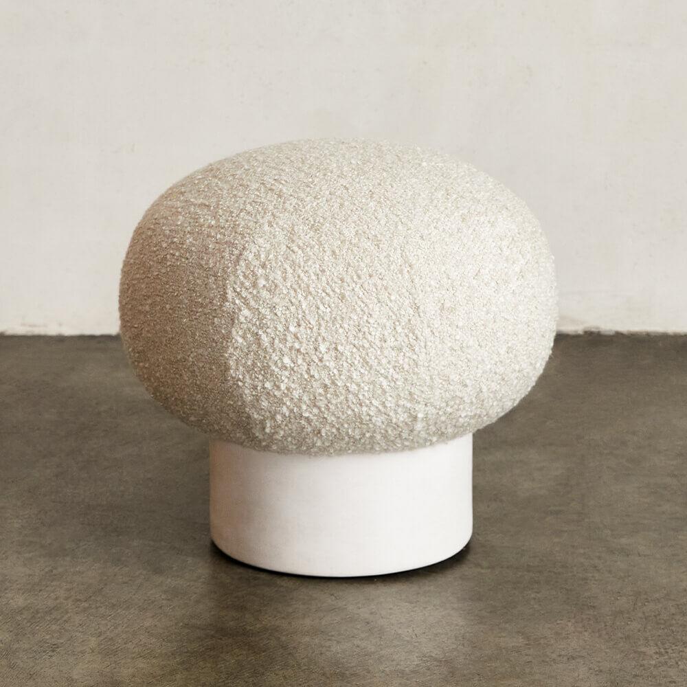 With its monolithic massing and sculptural play on materiality, the Colina Stool is an approachable iteration of modern organic design. This stool is made by a local LA artisan from hand-formed white resin with a plaster-like white finish.