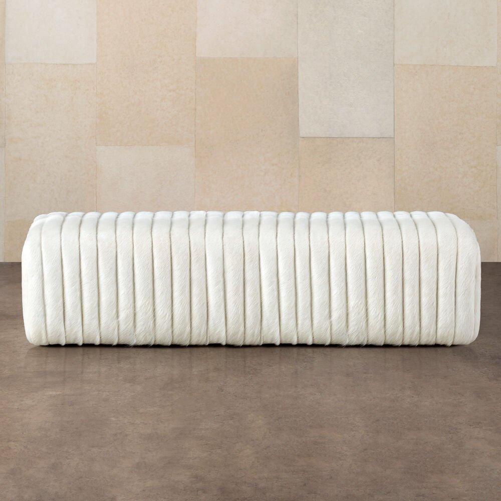 A modern assemblage of comfort and form, the Loma bench has a monolithic silhouette with narrow channel detailing. This fully-upholstered ottoman is available in a selection of curated fabrics and leathers. Covered in beige calf hide.