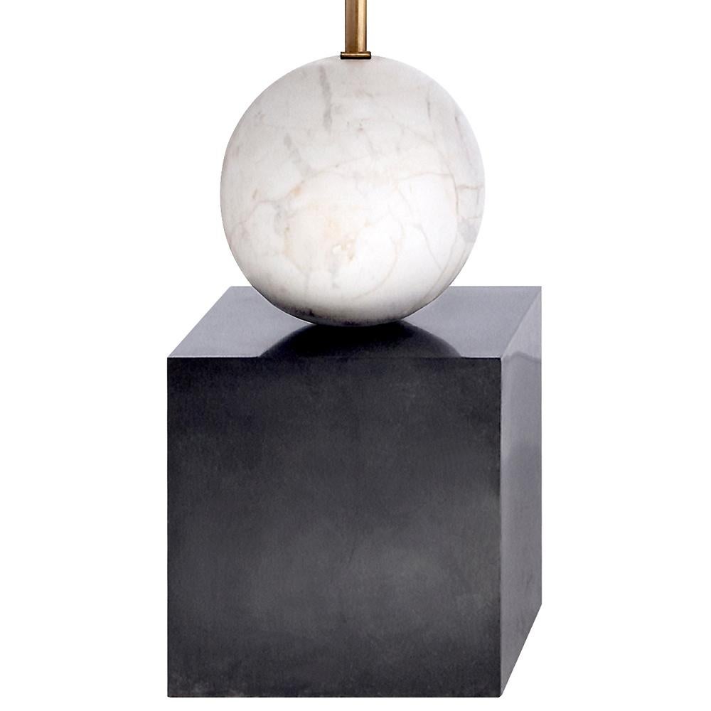 A dramatic and architectural take on Kelly’s signature use of mixed metals and geometric forms, this refined and bold lamp juxtaposes organic feminine curves with sleek masculine precision. Its distinctive voice is full of modern sophistication and
