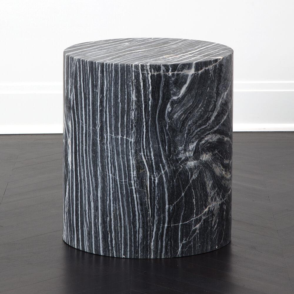 Carved out of a block of solid marble, this design can be used as a seat, plinth, or an occasional table and is perfect for a shower or a garden. The cylindrical form is a perfect canvas for the richly veined and smoothly finished marble. Each stool