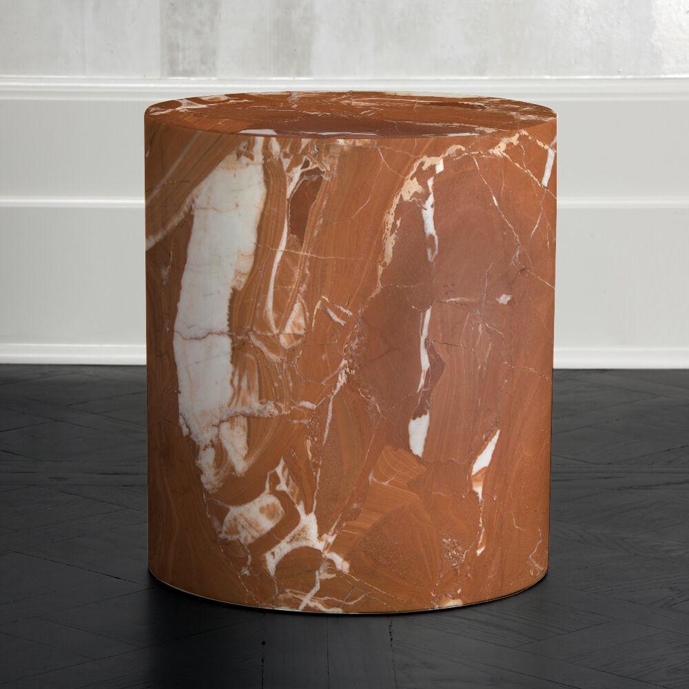 Carved out of a block of solid marble, this design can be used as a seat, plinth or an occasional table and is perfect for a shower or a garden. The cylindrical form is a perfect canvas for the richly veined and smoothly finished marble. Each stool