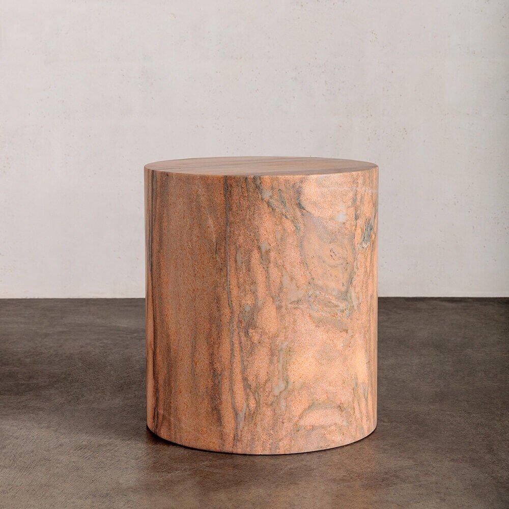 Carved out of a block of solid marble, this design can be used as a seat, plinth or an occasional table and is perfect for a shower or a garden. The cylindrical form is a perfect canvas for the richly veined and smoothly finished marble. Each stool