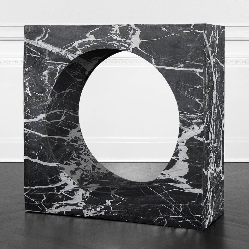 Carved from a massive solid block of marble, the Selby Console, is a manifestation of organic minimalism. A perfectly incised center cylinder creates a dramatic negative space. Sealed and honed for richness, the Selby has gorgeous movement in any of
