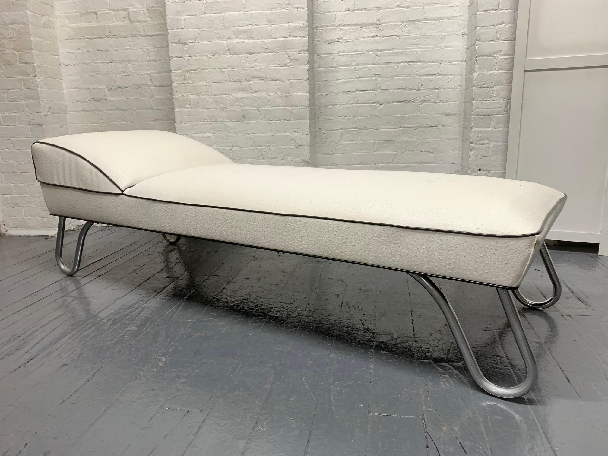 Daybed upholstered in embossed vinyl with black trim. Have tubular chrome legs. Mid-Century Modern.