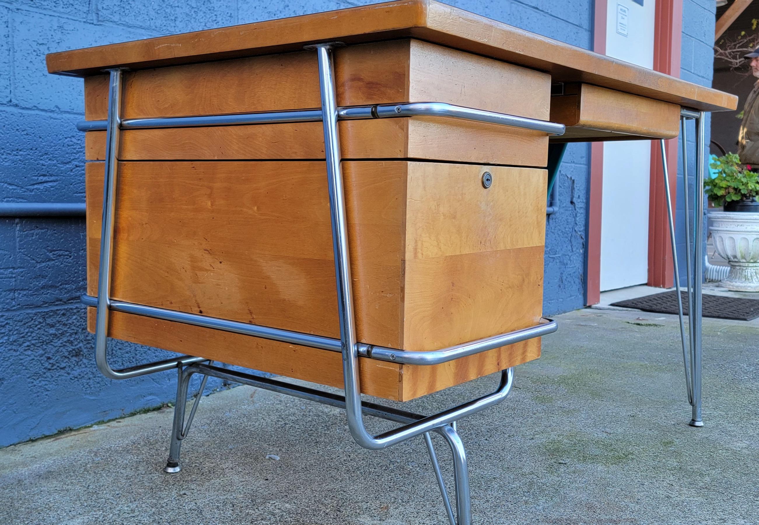 An exceptional collaboration between Kem Weber and Heywood Wakefield created this amazing industrial Modern / Mid-Century Modern desk. A combination of steel, maple and laminate. Vibrant turquoise painted steel skirt adds to the beauty and detail of