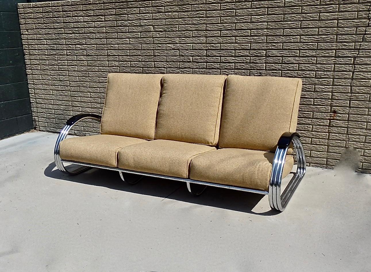 Sexy art deco machine age moderne chrome frame tear drop arm loose cushion sofa. Designed by KEM Weber for Lloyd in the 1930s. Cushions shown in original vinyl which has been replaced do show wear and age. Re upholstery is recommended. Frame shows
