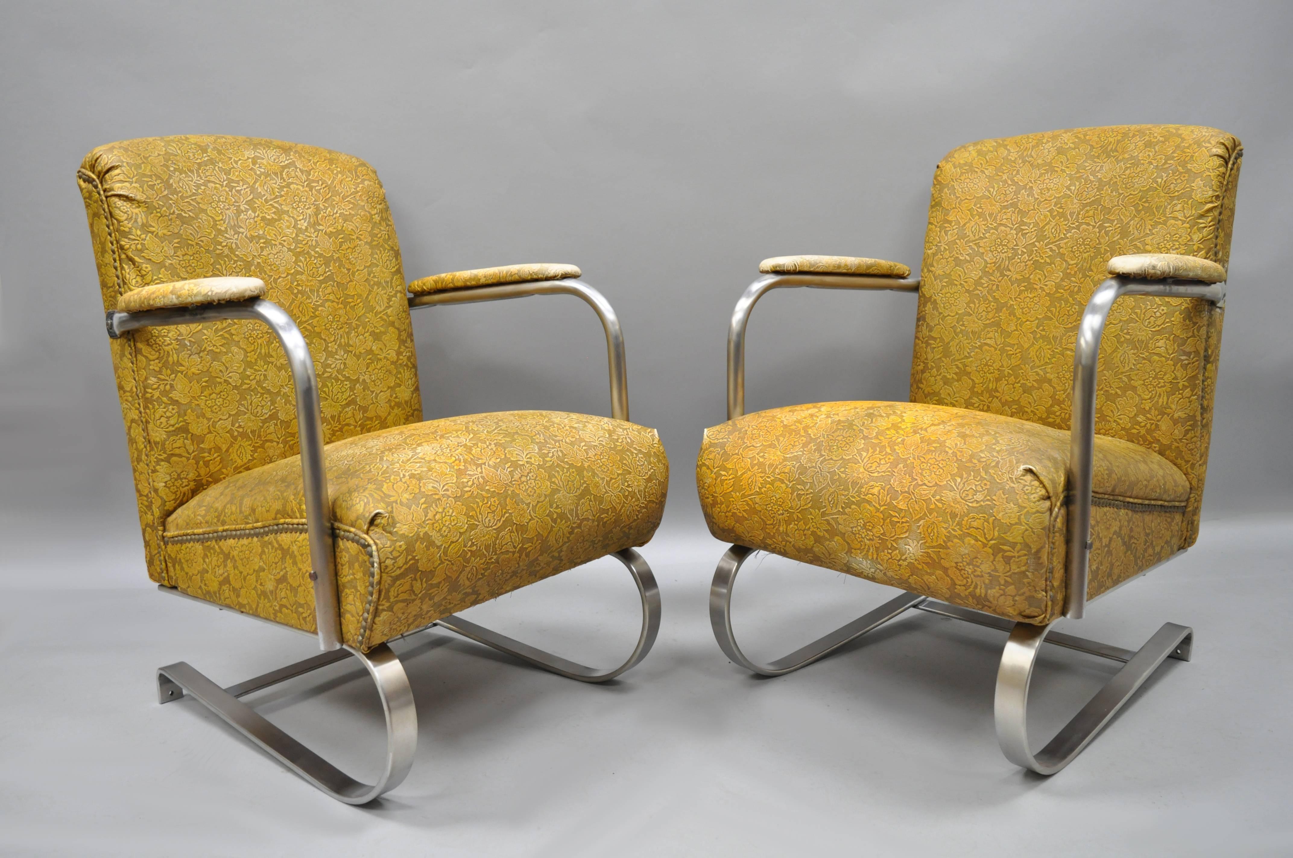 Vintage Art Deco / Machine Age Lloyd Springer chrome tubular and steel armchairs with rare upholstered frames, in the style of KEM Weber. Chairs feature heavy metal frames, fully upholstered in the original yellow floral vinyl, upholstered armrests,