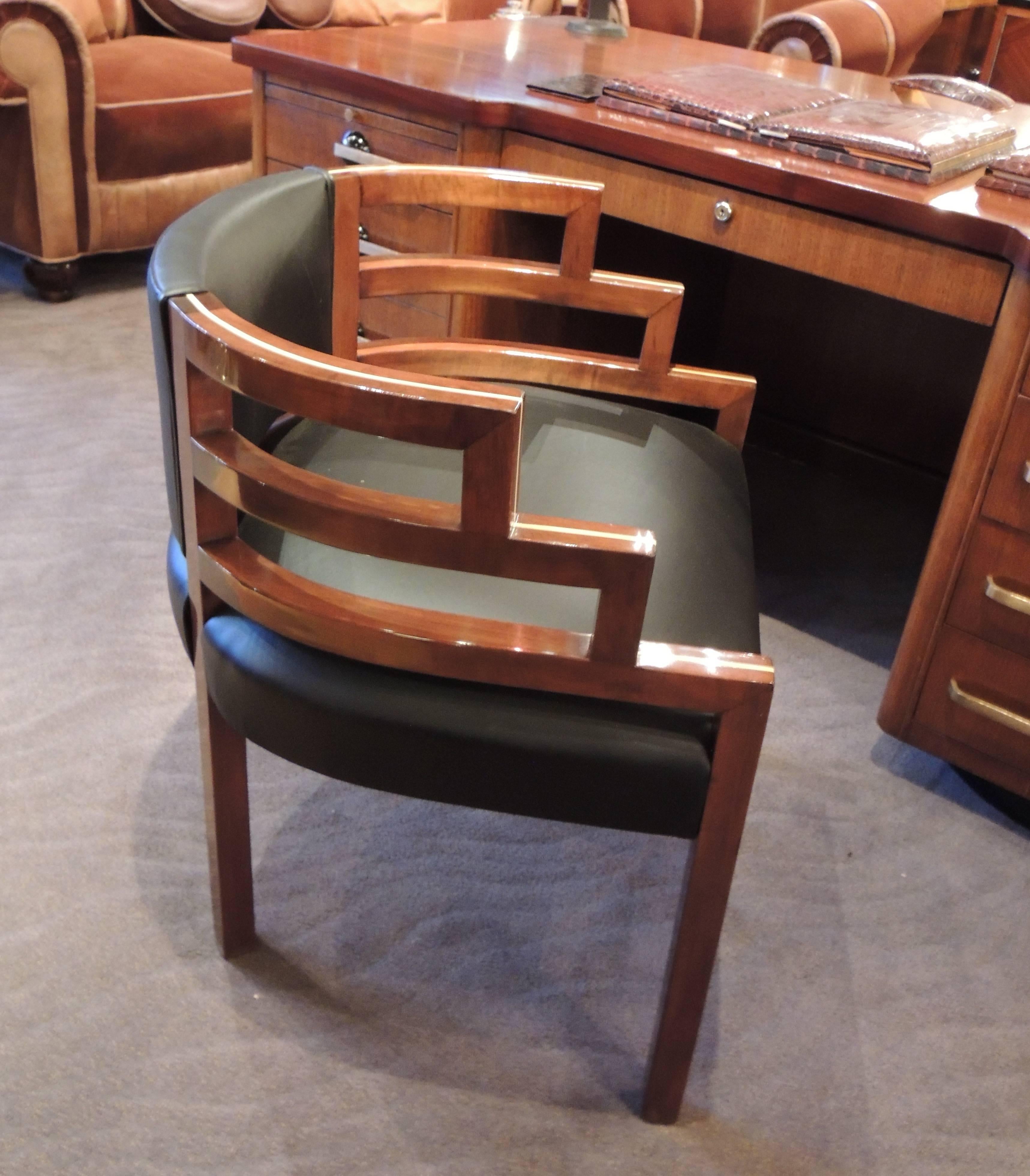 These Art Deco chairs in the style of KEM Weber were custom made exclusively for Art Deco collection. They combine a modernist stair-stepped design with comfort and upholstery that improves upon the original. The wood frames are solid with a medium