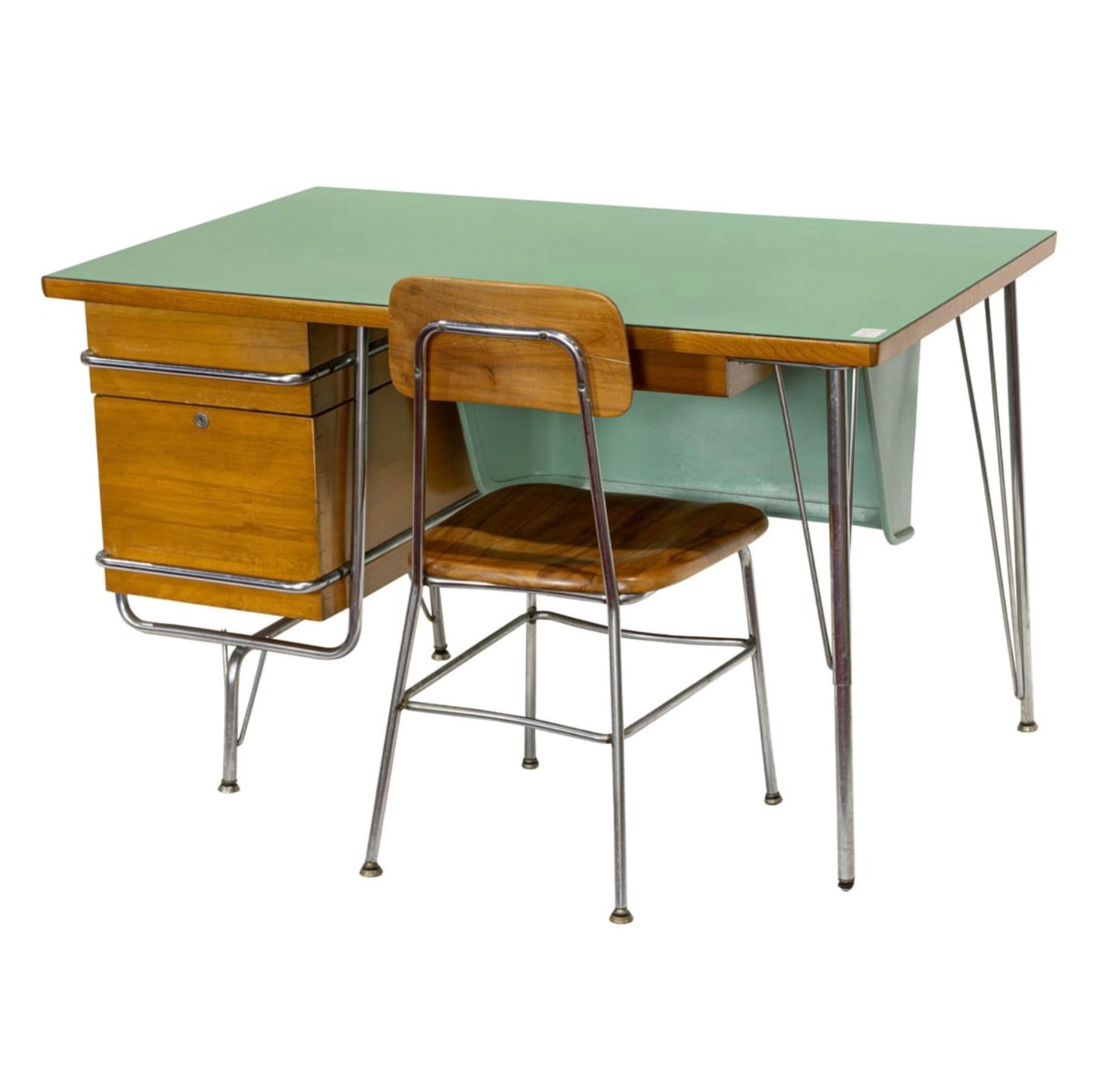 A very cool looking desk and matching chair designed by Kem Weber for Heywood Wakefield’s Trimline group. The desk has a great green laminate top. The matching chair is wood and steel. The desk top has a few minor marks and a darker area. The