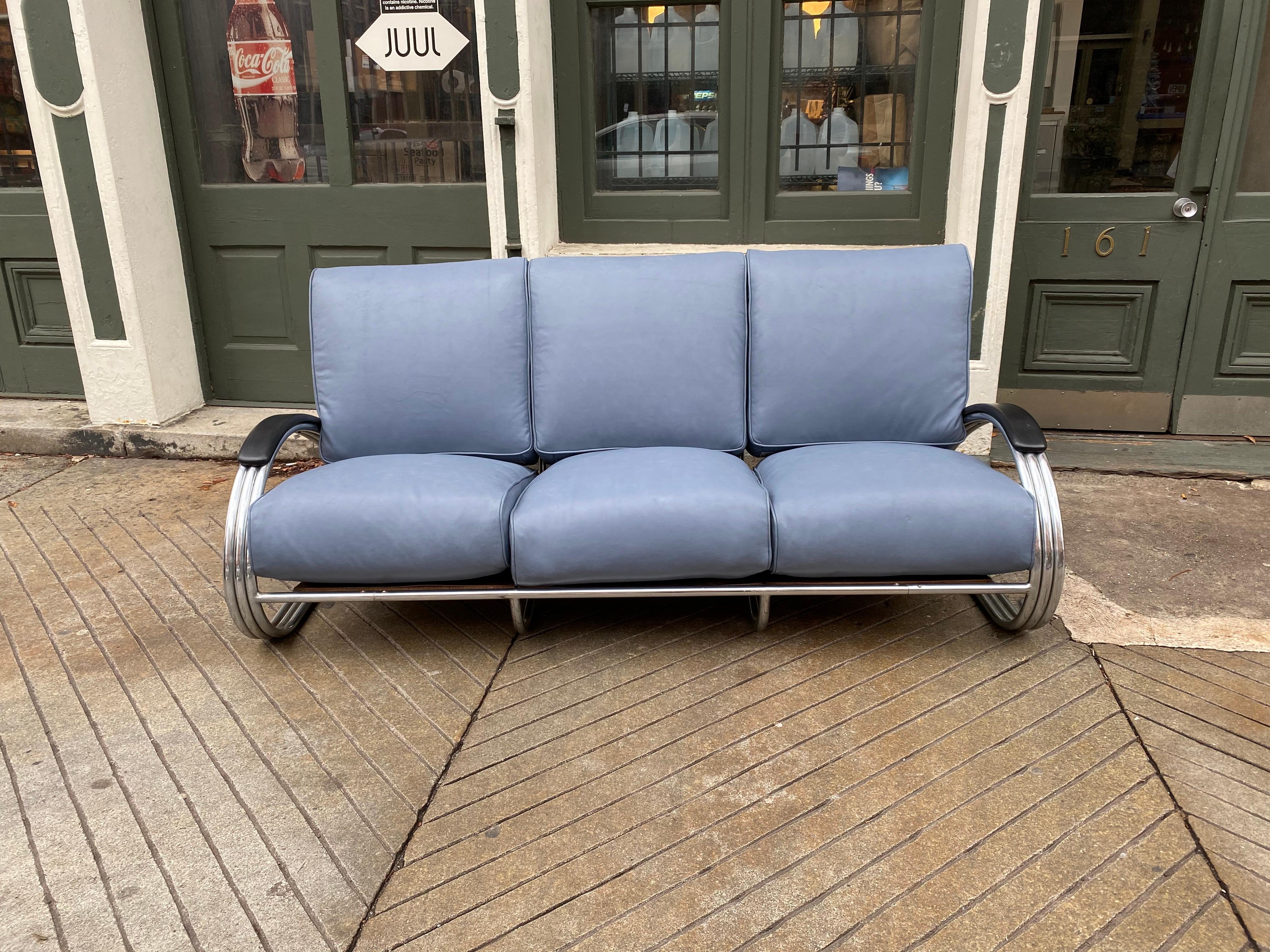 KEM Weber for Lloyd Chrome triple band Machine Age sofa. One of the most iconic streamline modern pieces out there! The promise of speed! Newly reupholstered in a light blue/gray leather. All inner springs re-tied and present. Great pains to reuse