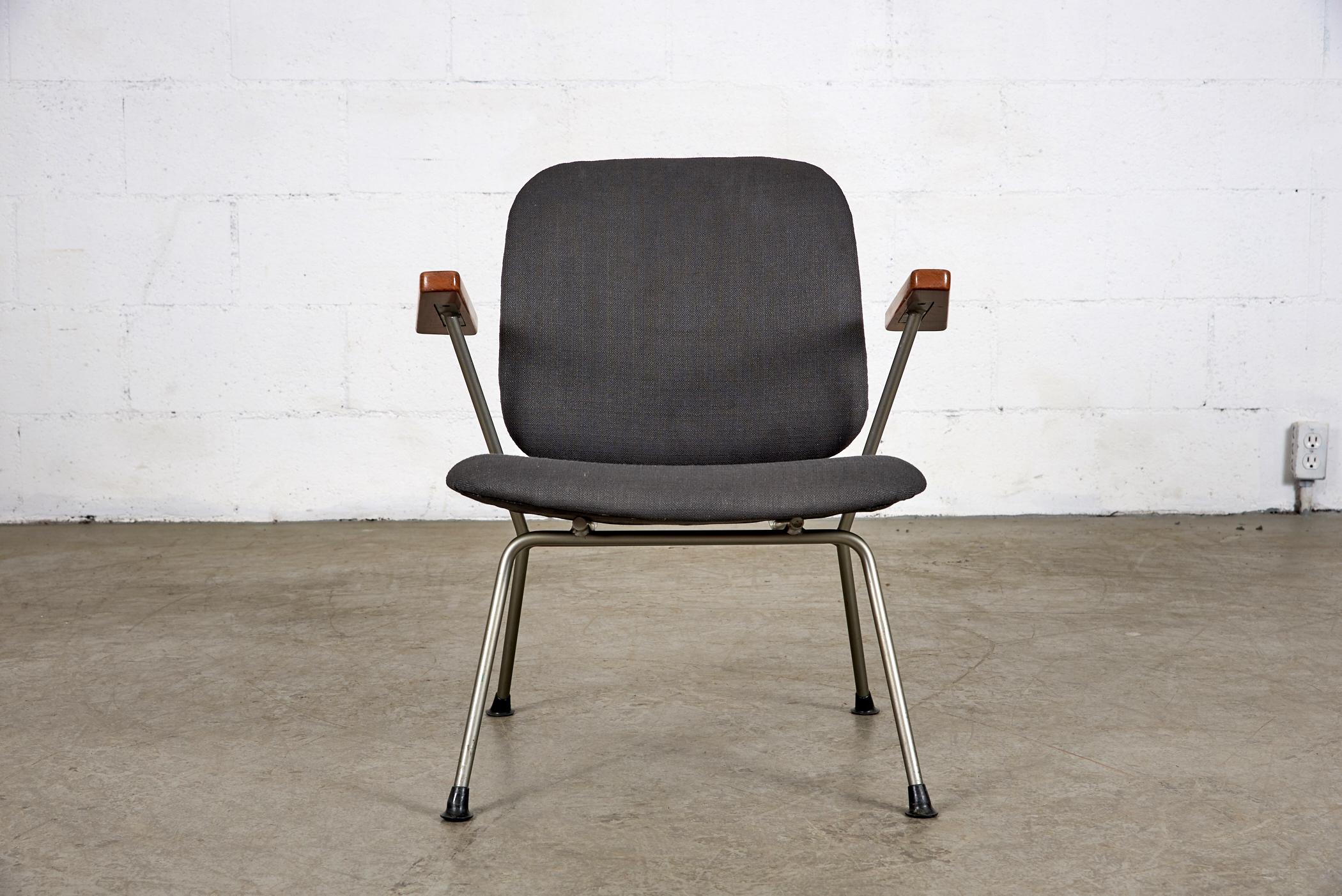 Kembo lounge chair newly upholstered in almost black fabric, with original steel grey frame, and lightly refinished teak arms. In original condition with some signs of wear consistent with its age and use.