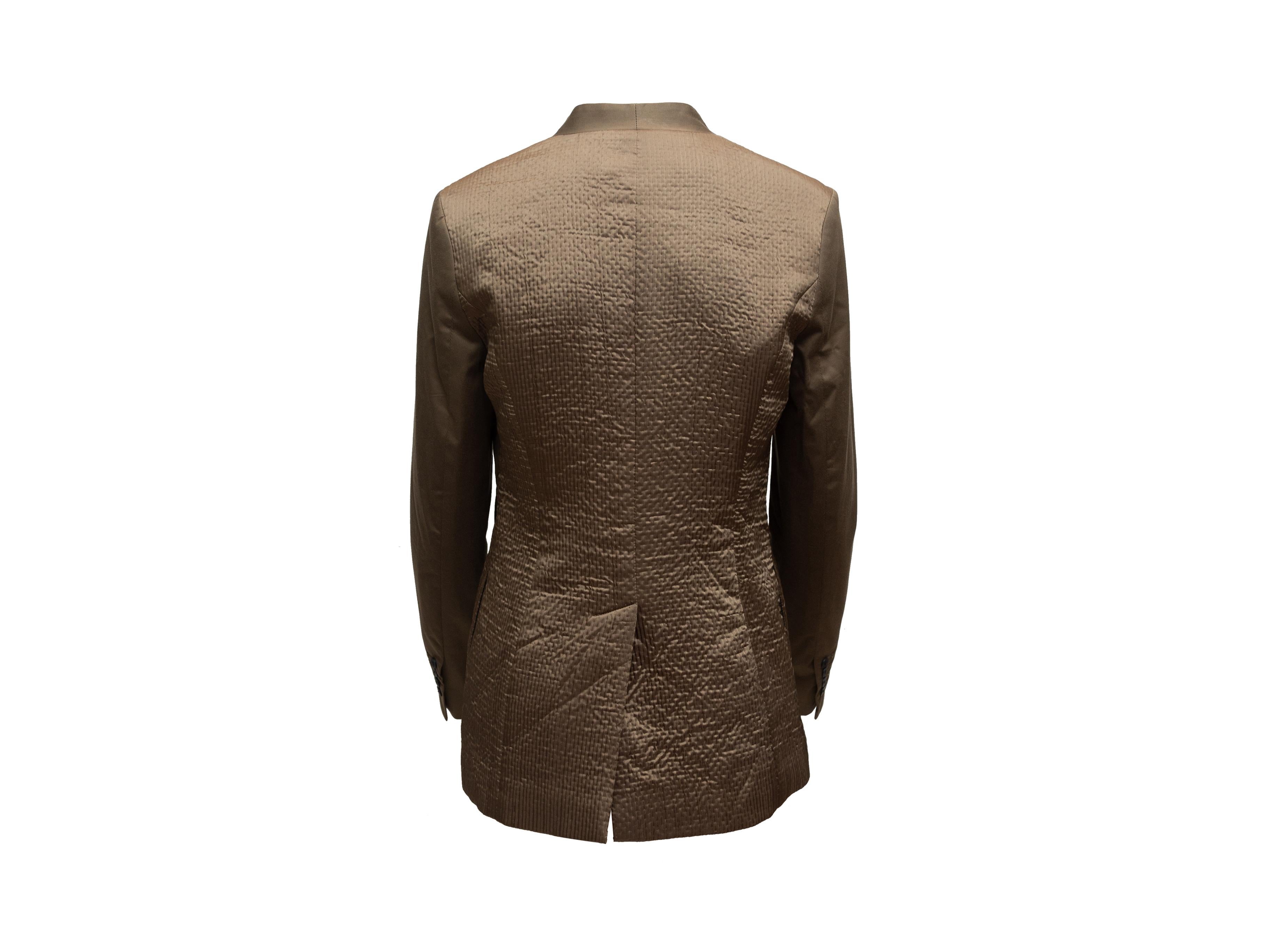 Product details: Brown satin collarless blazer by Kempner. V-neck. Quilted back panel. Hook-and-eye closure at front. 34