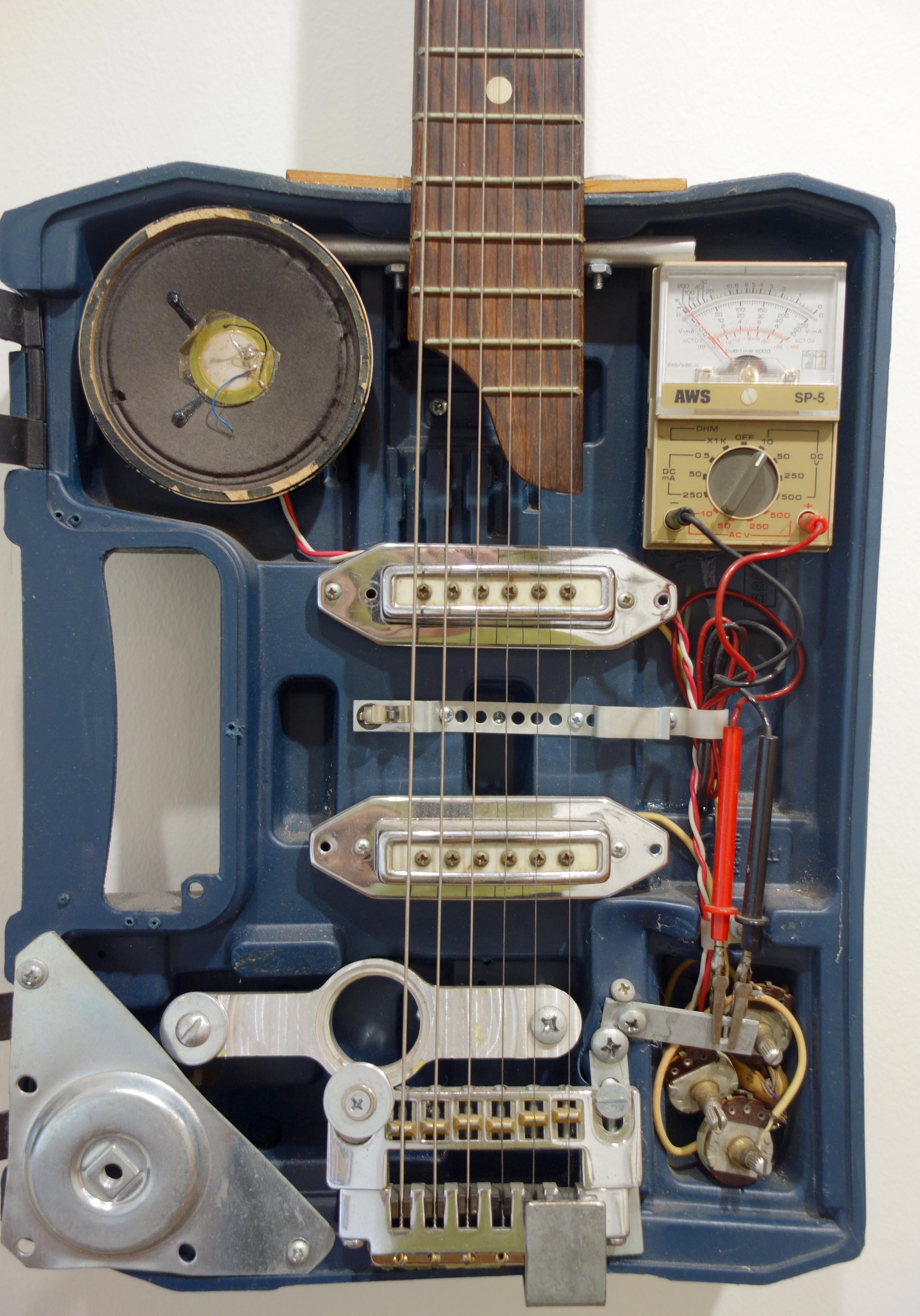 Sculpture murale hybride instrument de guitare Drill Case Guitar - Gris Figurative Sculpture par Ken Butler