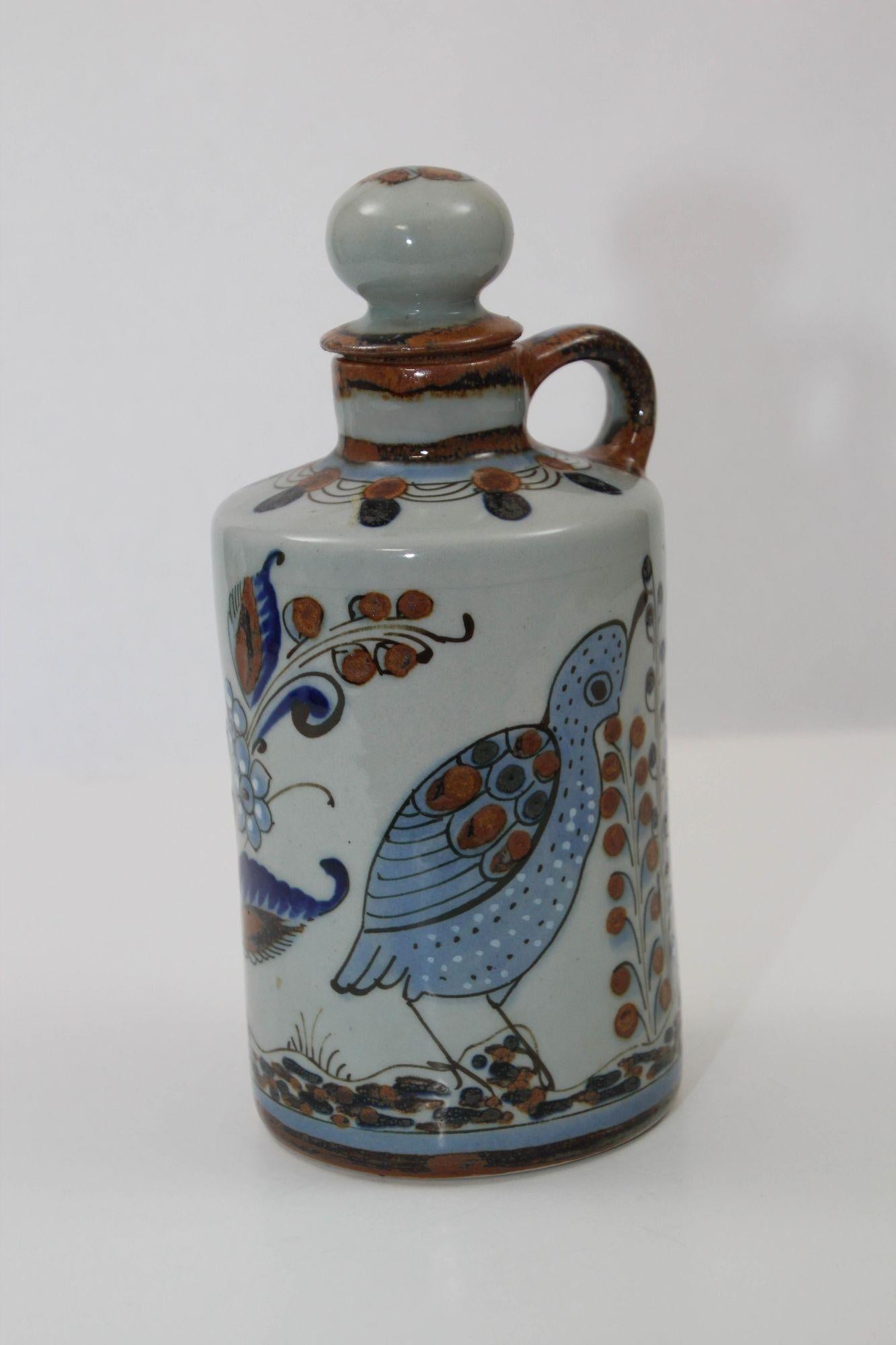 Ken Edwards Hand Painted Signed El Palomar Tonala Mexico Art Pottery Bottle with Cork 1960s.
Vintage Folk Art Mexican pottery handcrafted beautifully hand-painted Tonala bottle with botanical, a quail, another bird, butterflies, and flowers.
Vintage