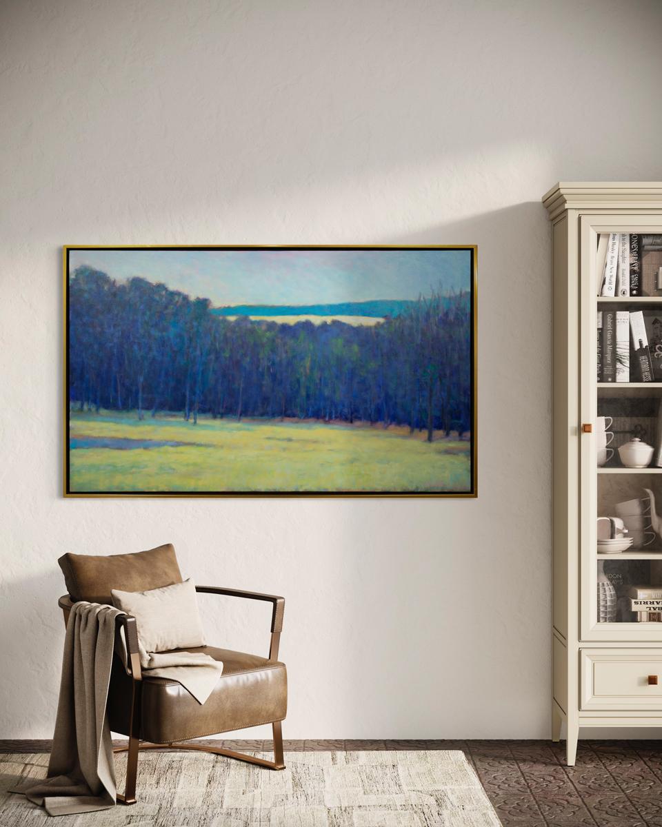 This contemporary abstract landscape painting by Ken Elliott is made with oil paint on canvas. It captures a scene with cool blue and violet trees in front of rolling hills under a pale blue sky, with a contrasting, vibrant yellow-green foreground.