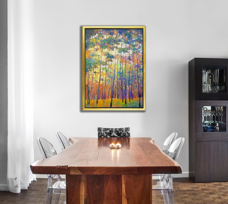 This colorful abstract landscape limited edition print depicts a forest, with trees with thin trunks in the foreground, and leaves that seem to incorporate almost every color. Bursts of green, deep blues, orange, and pink come together to create the