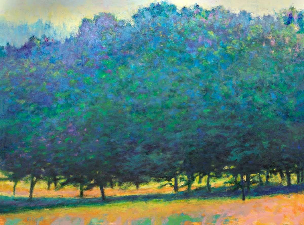 This contemporary abstract landscape limited edition print by Ken Elliott features tall, lush trees, the leaves of which are cool blue and violet tones. Small portions of the bottoms of the trunks are just visible beneath the dense forest leaves,