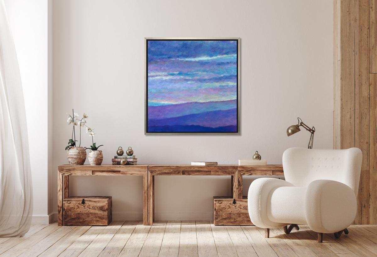 This contemporary abstract landscape limited edition print by Ken Elliott features a cool blue and violet palette, capturing rolling hills underneath thick, hazy clouds, with contrasting accents of warm yellow peaking out throughout the sky. 

This