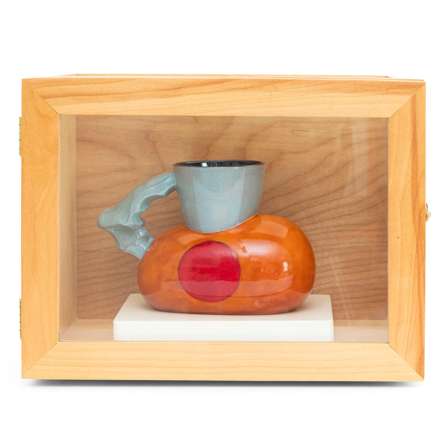 Ken Price 
Chet (INV# NP5004)
glazed earthenware
cup: 4 x 5.88 x 3"
handmade wooden box: 8 x 1.38 x 5.63"
1991
#24/25 
signed, dated, and numbered
provenance The Nevica Project
provenance Gemini GEL 

Ken Price (1935 - 2012) received a BFA from the