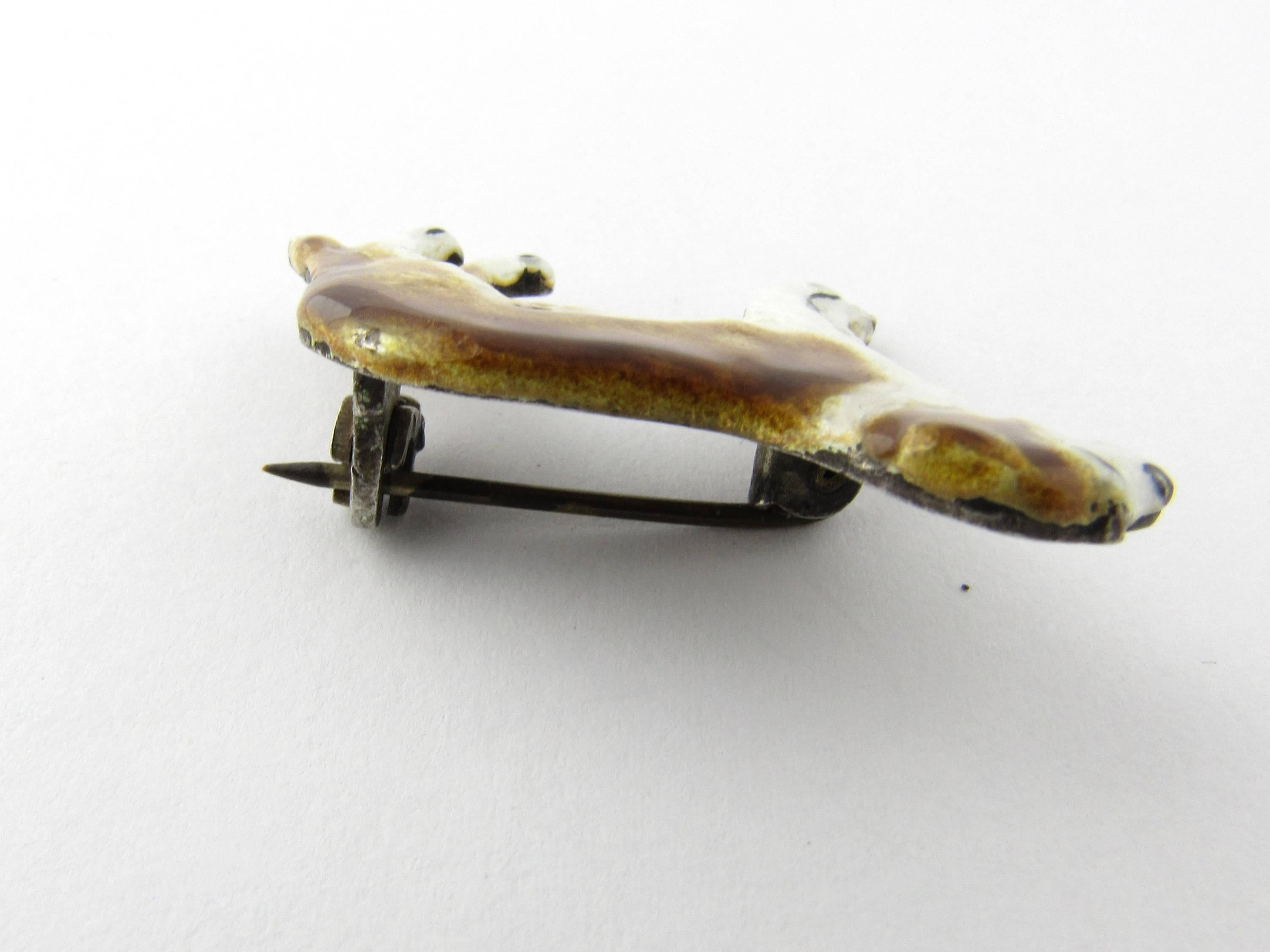 Vintage Kenart Enamel St. Bernard Pin/Brooch- 
This wonderful pin depicts a St. Bernard dog meticulously detailed in brown and white enamel. 
Size:  38 mm x  27 mm 
Weight:  5.7 dwt. /  9.0 gr. 
Hallmark: Reg. NO. 534187 KENART MADE IN ENGLAND