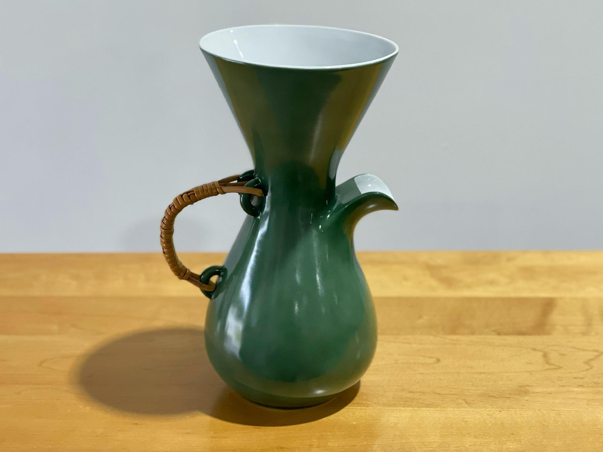 Exquisite modernist coffee carafe designed by Kenji Fujita for Freeman Lederman. Beverage pitcher in rare green glaze with glossy white interior. Marked with the FL logo. 
Excellent condition - no issues of note
This will be professionally packaged,