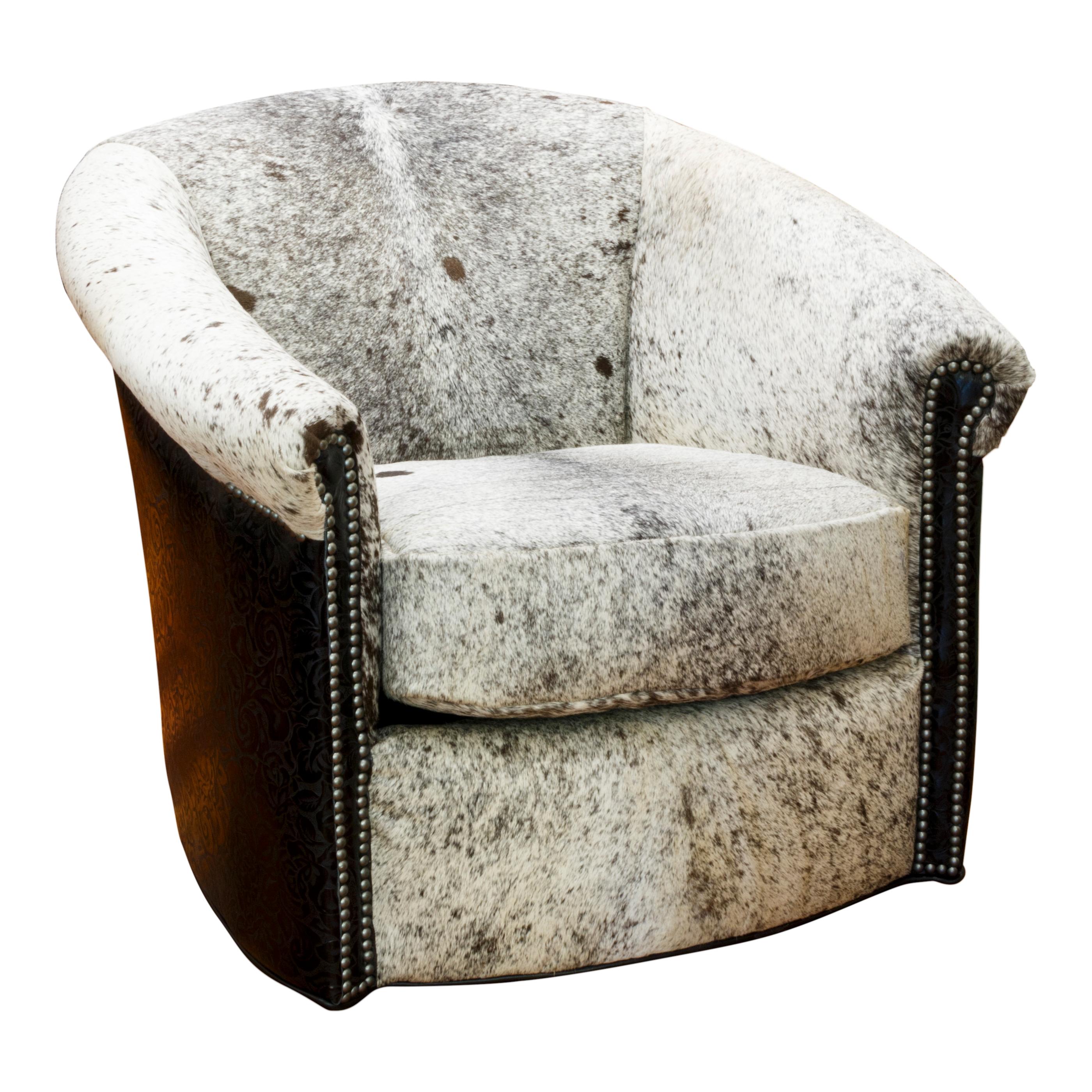 Kennedy Collection swivel chairs with speckled spotted long-horn hide with sides and back of embossed leather. 32