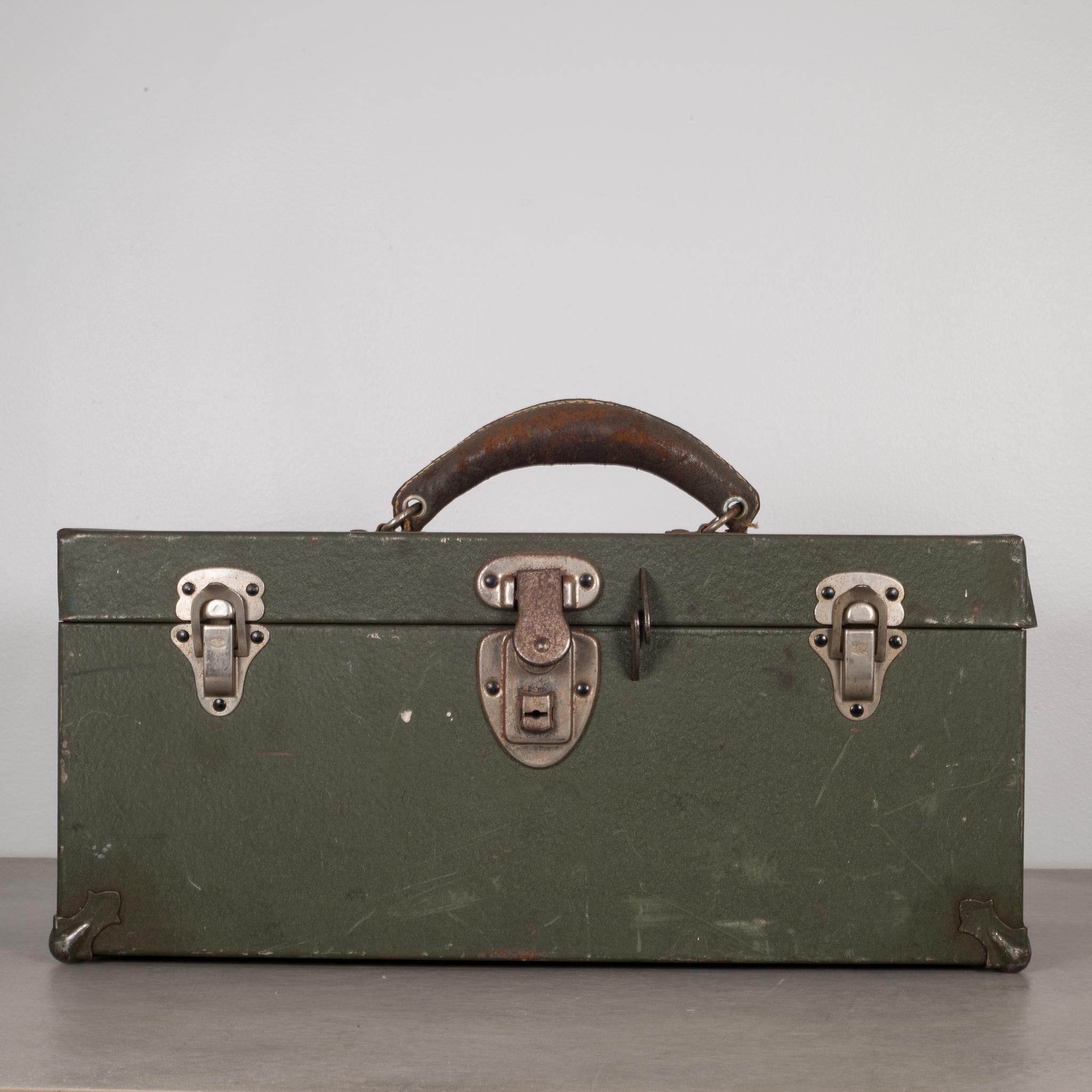 About

This is an original Kennedy Kit toolbox. A metal toolbox with three latches and a distressed leather handle. The main thumb latch works properly but there is no key. This piece has retained its original army green finish and has the proper