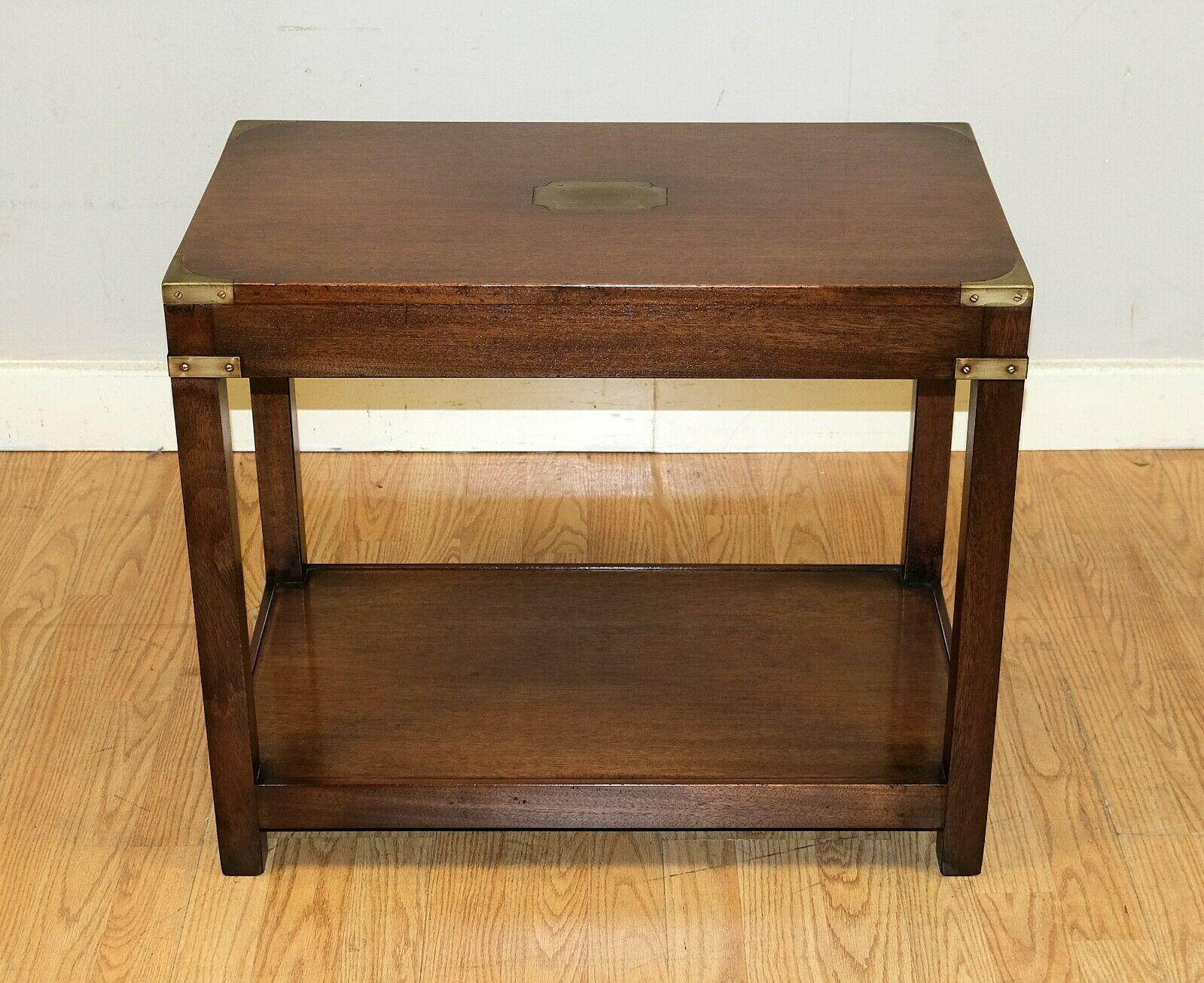 We are delighted to offer for sale this lovely Kennedy mahogany military campaign side table with brass details.

This attractive and well-made side or occasional table can add style to any room, thanks to its colour and good size. This campaign