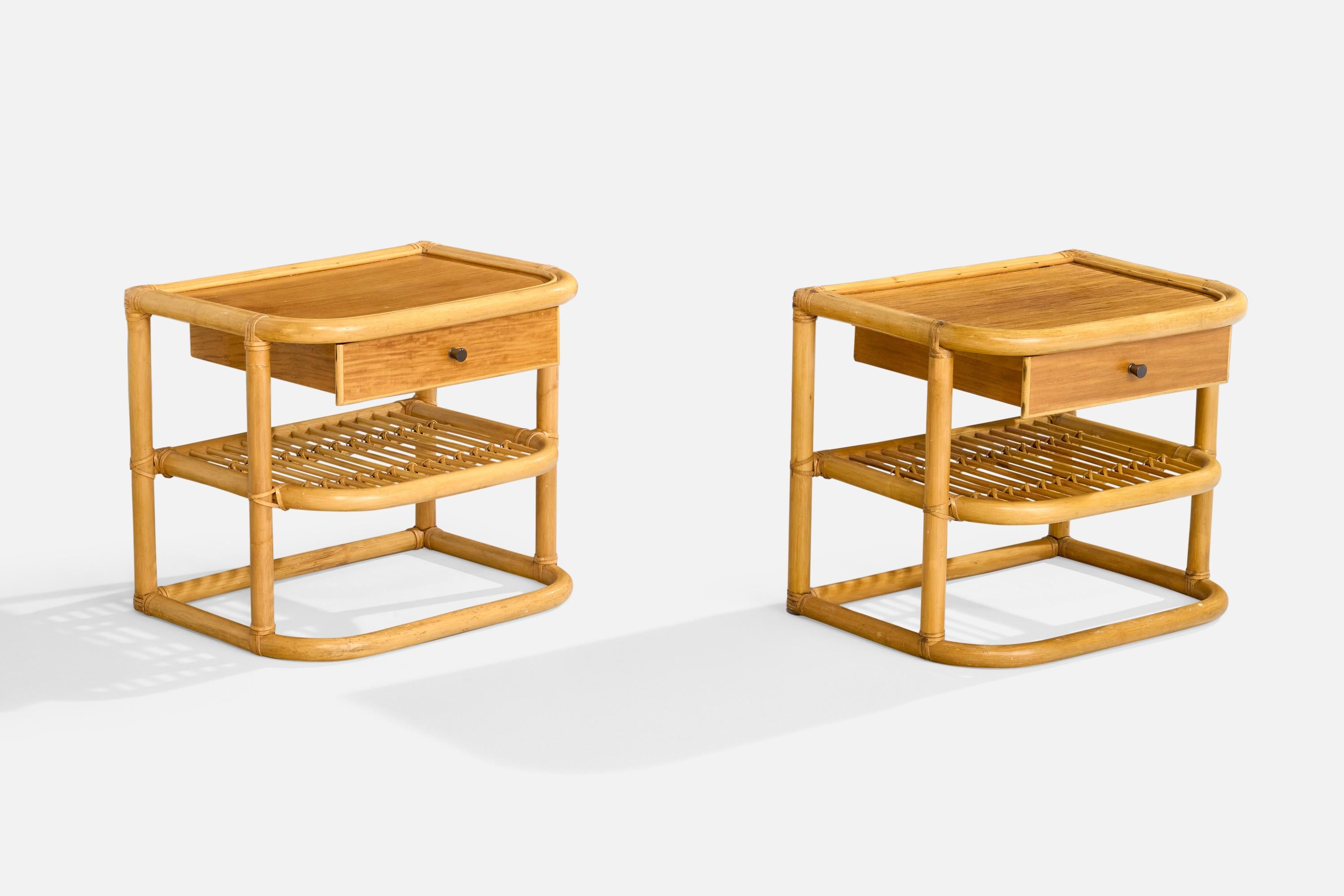 A pair of bamboo, wood, rattan and brass nightstands designed by Kenneth Bergenblad and produced by Dux, Sweden, c. 1970s.

Dimensions: 18.9” H x 22.1” W x 16.6” D