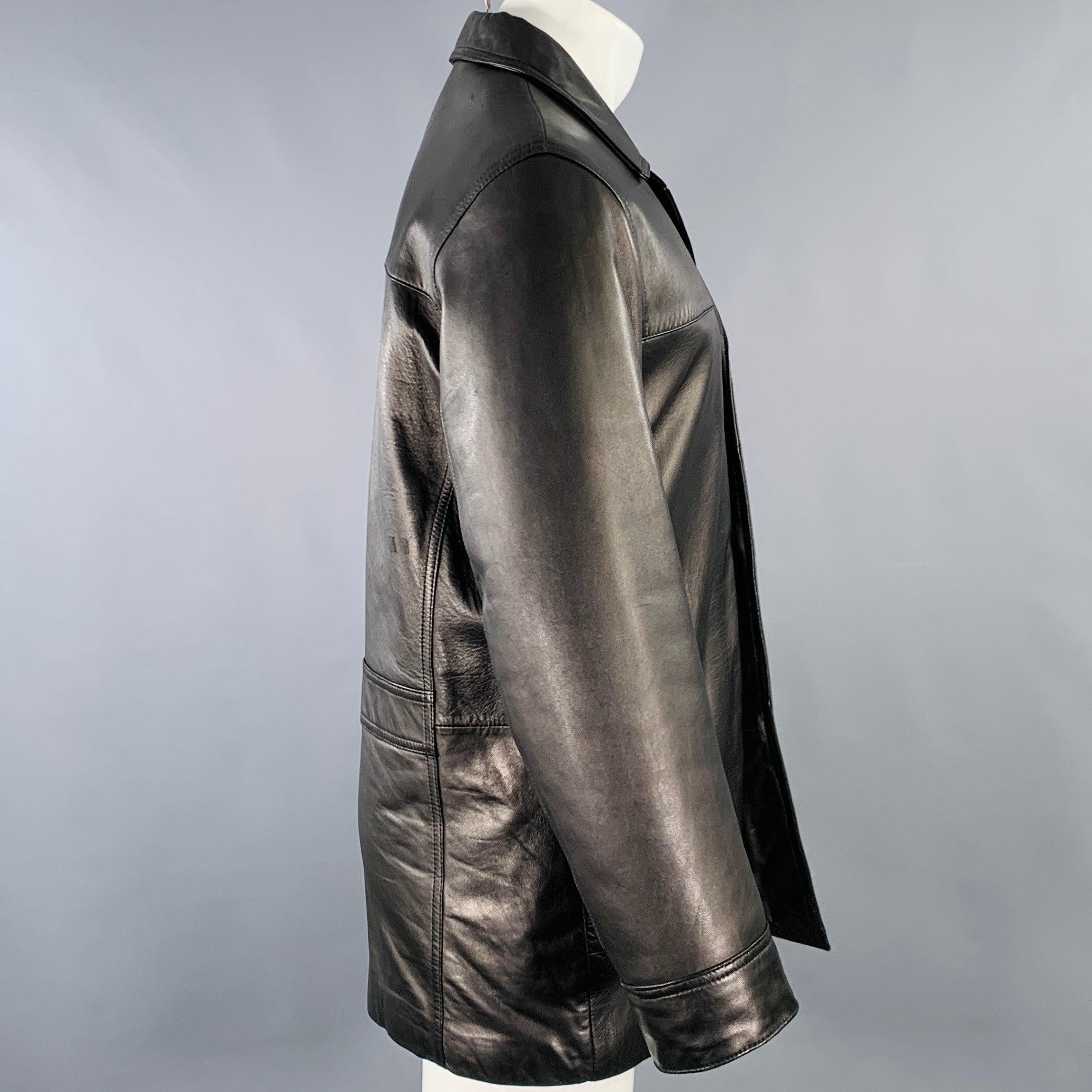 REACTION by KENNETH COLE coat
in a
black leather featuring a single breasted style, slip pockets, and button closure. Excellent Pre-Owned Condition. 

Marked:   S 

Measurements: 
 
Shoulder: 18 inches Chest: 43 inches Sleeve: 24.5 inches Length: