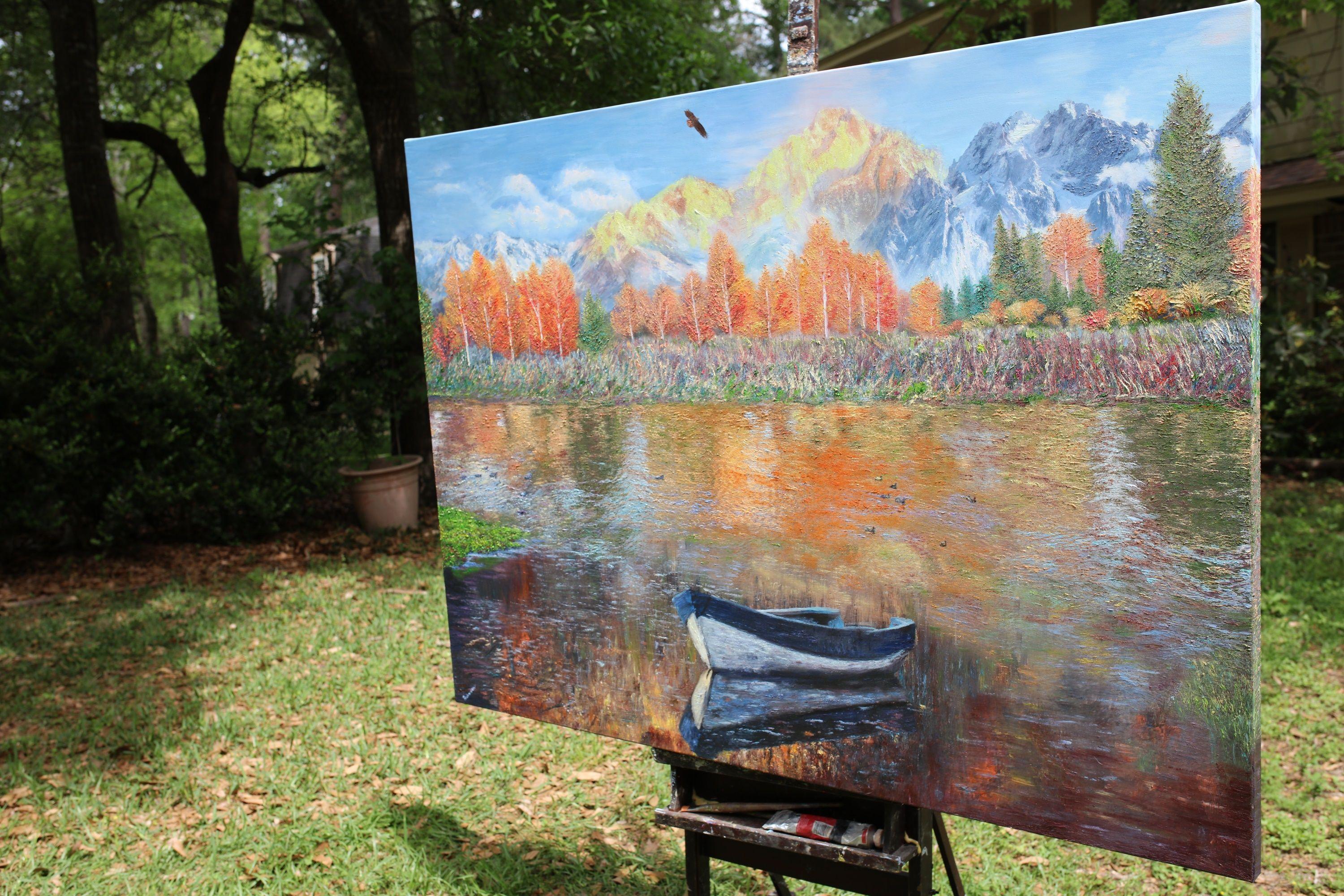 â€œAutumnal colors are radiant in this visage of a reflective scene of lake, boat, and woodland. The feeling is the nostalgic appreciation that everything has two sides.â€   The painting is executed in Clear Impressionism style in thick oils with