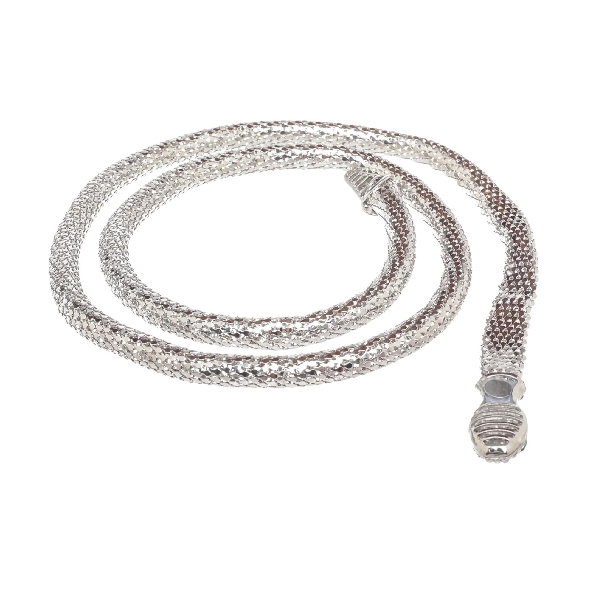 Edgy snake-inspired choker encrusted with crystals. Silver tone metal. Glass. Slip-on style.
 
Color: Silver tone
Material: Silver plated brass
Marks: Brand mark
Slip-on style
Year: Circa 2020
Condition: Very good. Item is pristine.

Made in Italy
