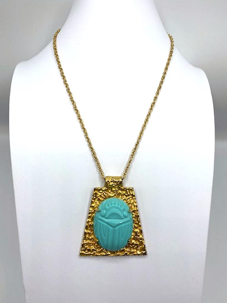 Dating from the late half of the 1970s to the mid 1980s is this unique Kenneth Jay Lane large scarab pendant necklace. Due to the popularity of the contents and artifacts of the King Tutankhamon exhibition that toured the world from 1972 to 1981,