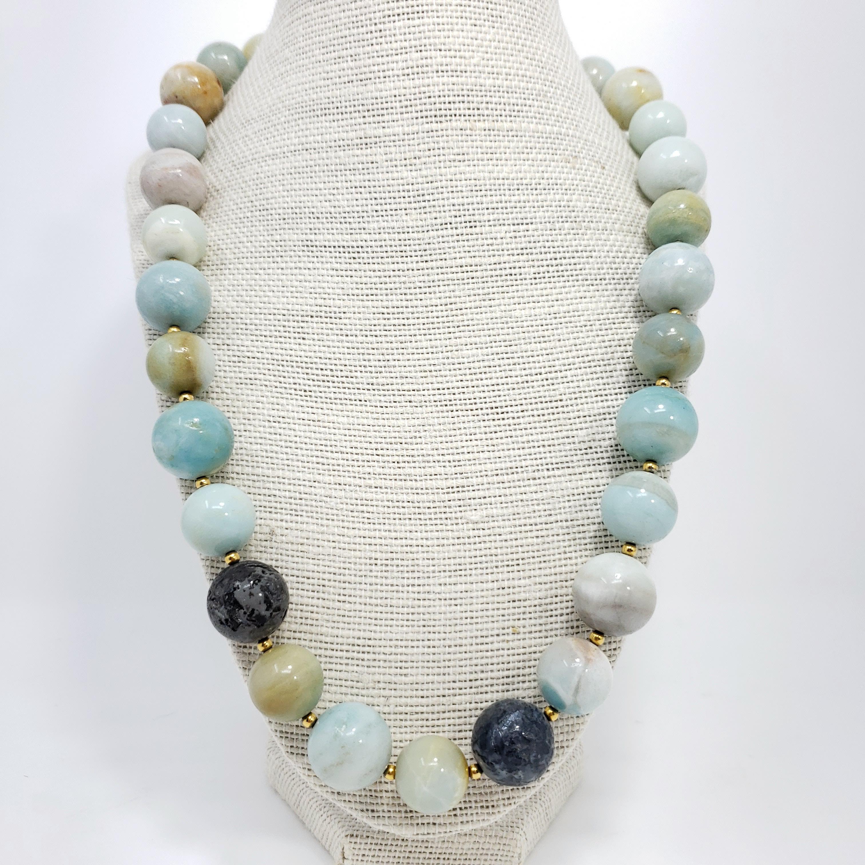 Kenneth Jay Lane amazonite bead necklace in earthy teal, tan, white, and gray tones. Gold-plated hook clasp.

Length: 59 cm / 23 in

Hallmarks: Kenneth Lane