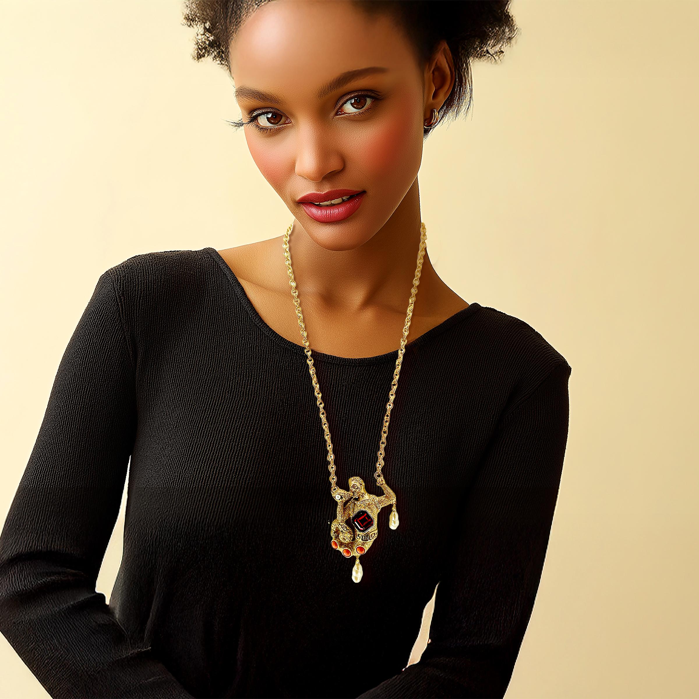 Kenneth Jay Lane antique gold Swarovski crystal mythological merman necklace features octagonal ruby crystal centerpiece with baroque pearl drops. Luxury designer jewelry for collectors. Museum-quality statement necklace. Made in USA.

This Kenneth