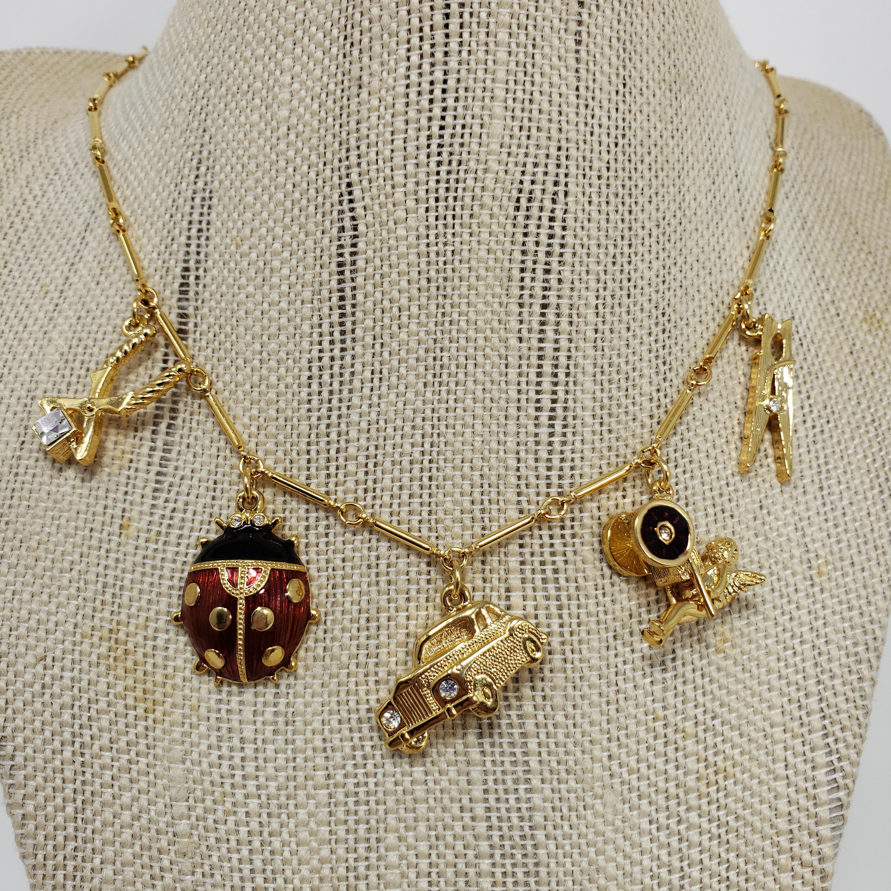 Kenneth Jay Lane Bar Link Charm Necklace in Gold, features Ladybug, Car, Angel In New Condition For Sale In Milford, DE