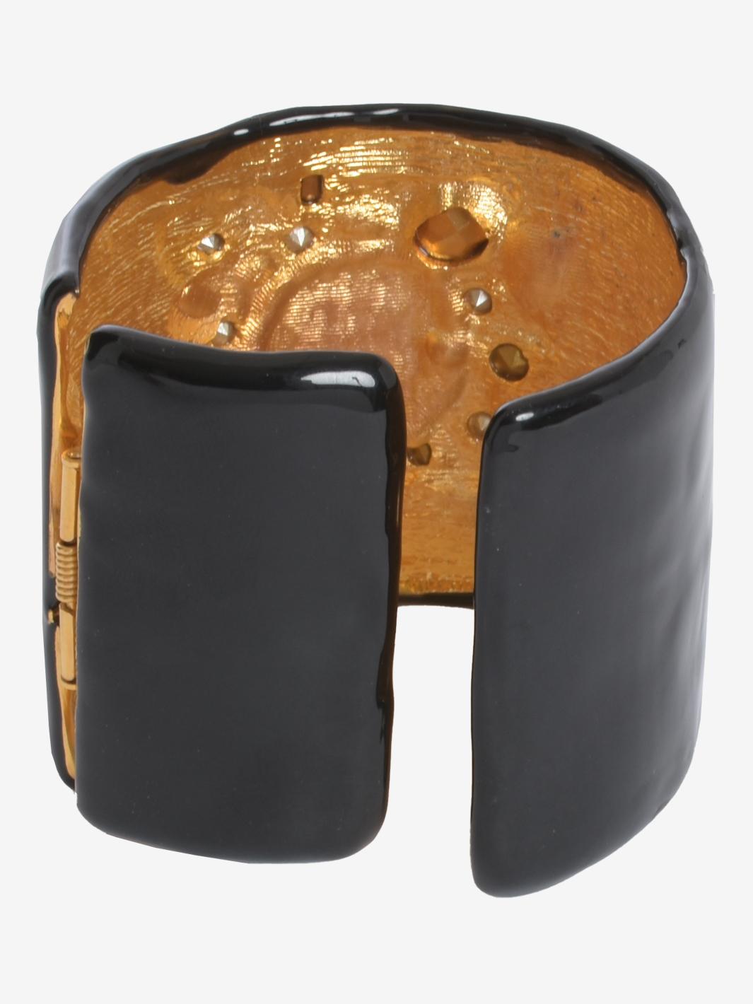 Kenneth Jay Lane Black Large Rigid Band Bracelet With Stones is a unique design much appreciated by Diana Vreeland, which Lane had created for her. Polychrome stones on cast American pewter plated hamilton gold.

STATE OF PRESERVATION
Good
