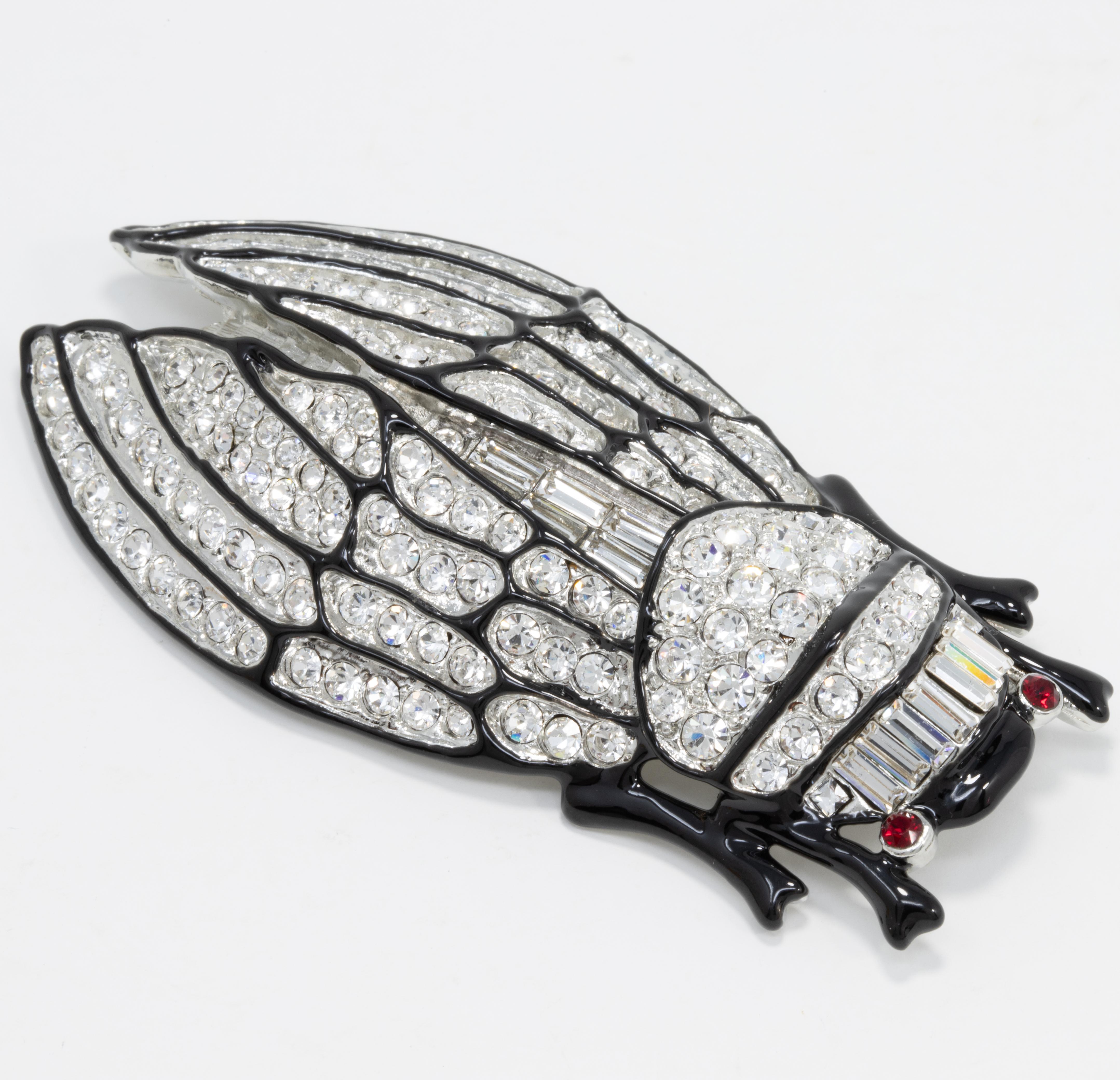 An elegant cicada critter decorated with glowing crystals and black enamel. A perfect touch of glamour!

Marks / hallmarks / etc: Kenneth Lane